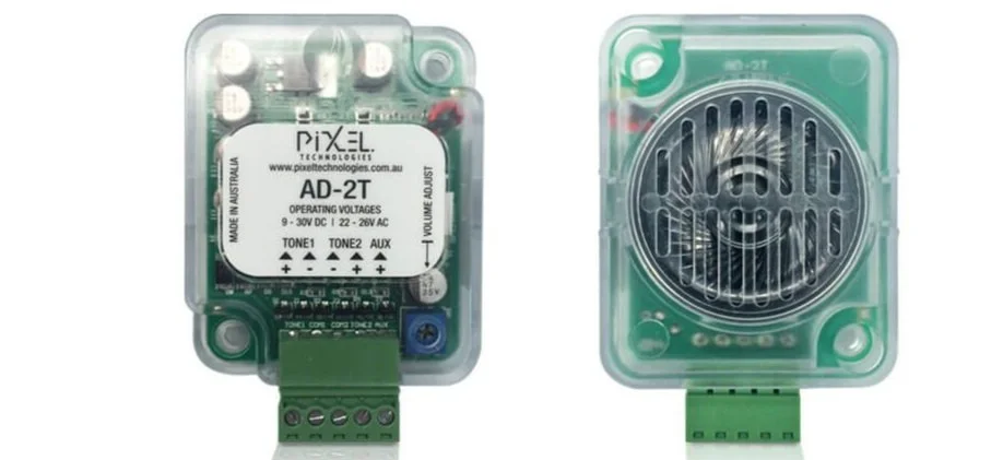 Two transparent green electronic devices, one with a labeled circuit board and the other with a round grill on top.