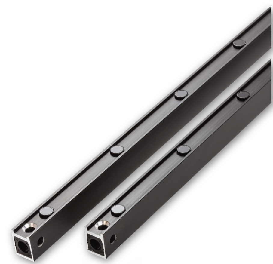 Two black linear rails with mounting holes and bearings