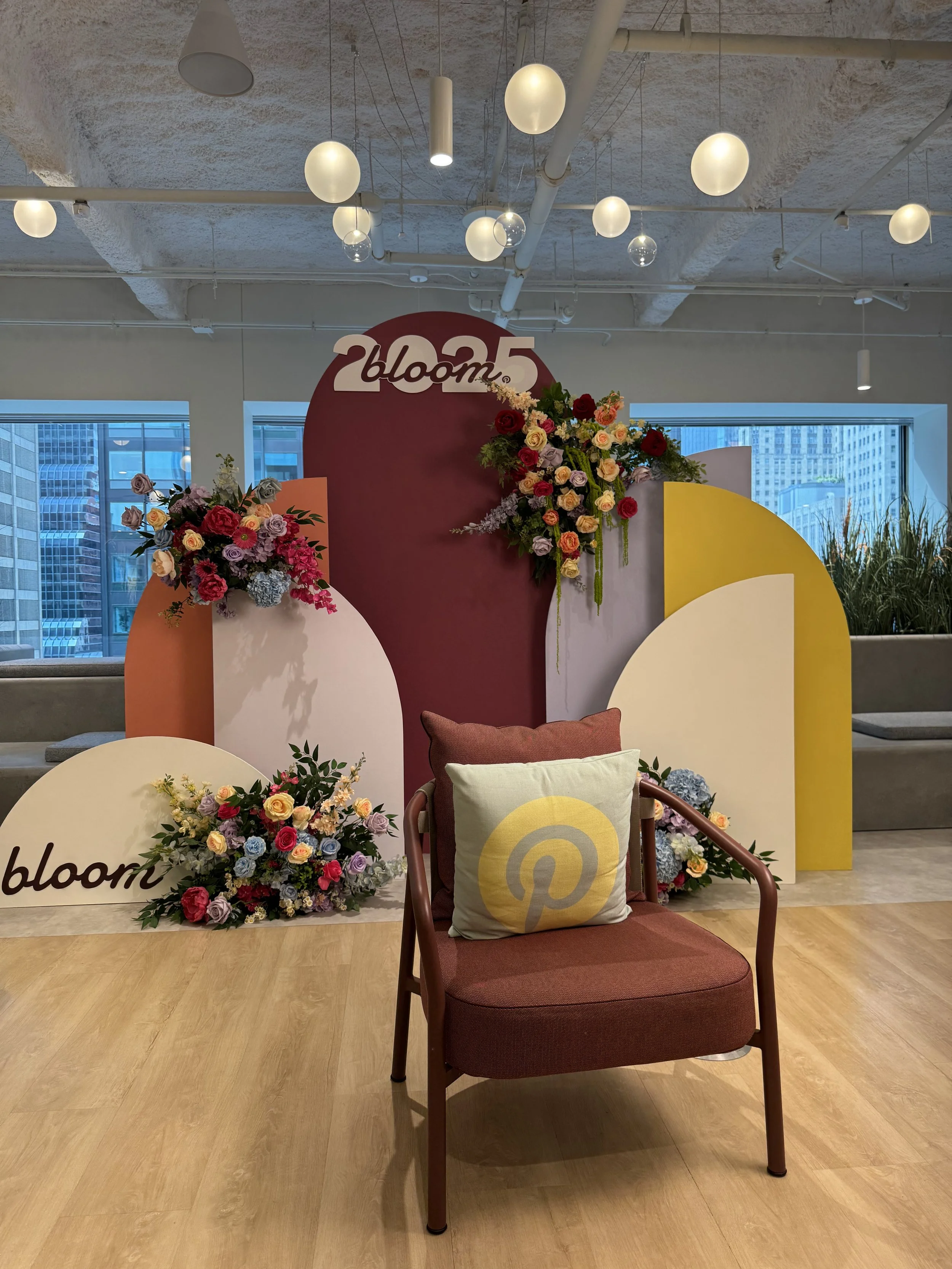 Luxury indoor picnic at influencer event in DMV’s Rockville Perfect Go office event space, featuring flowers, marquee letters, and balloons.