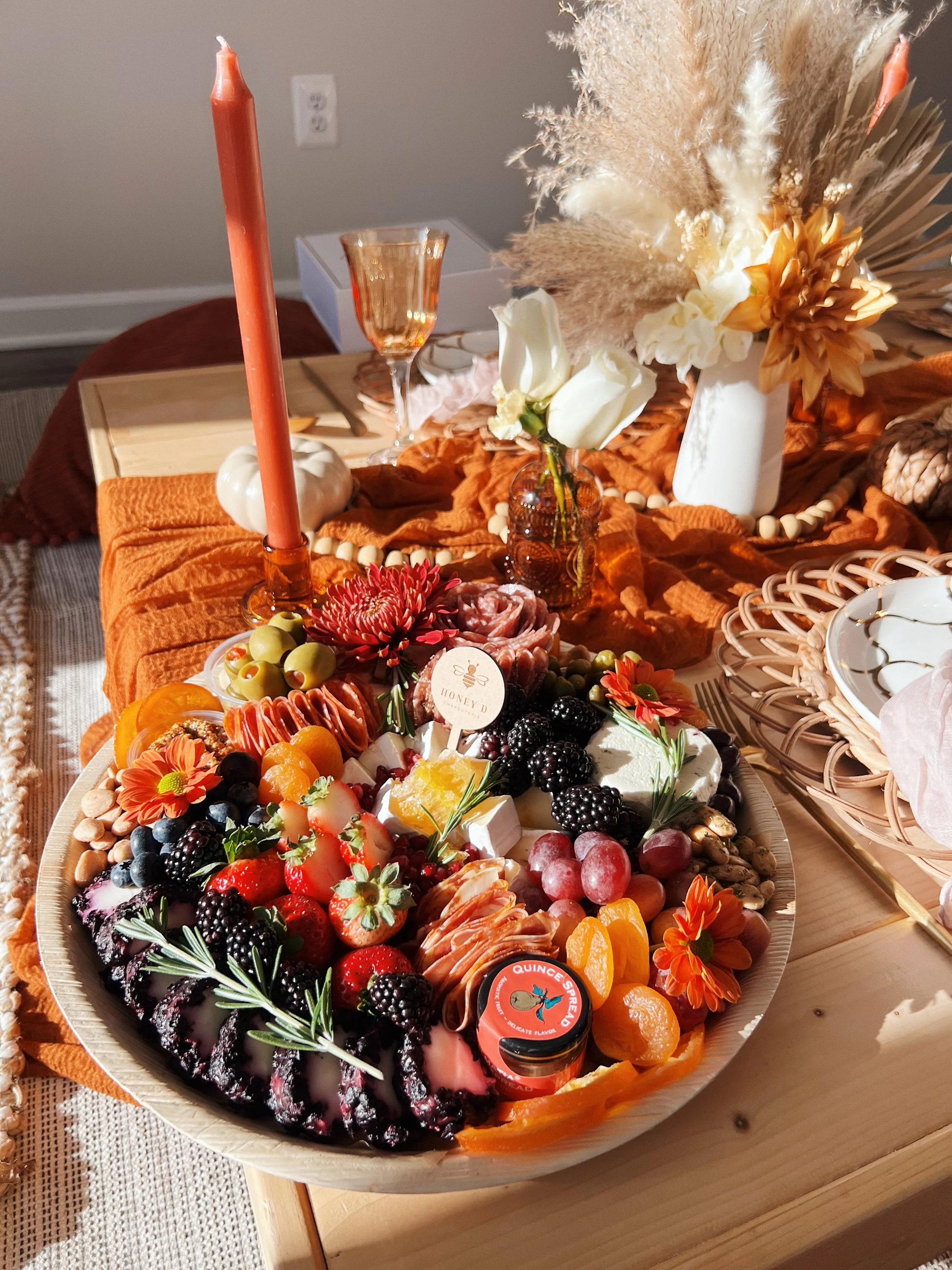 Charcuterie board by Honeydcharcuterie displayed on a picnic table