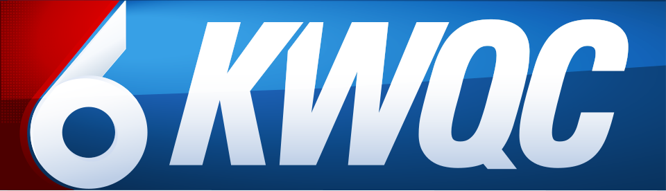 Logo of KWQC, a news station, with large white text on a blue background and a red accent on the left.