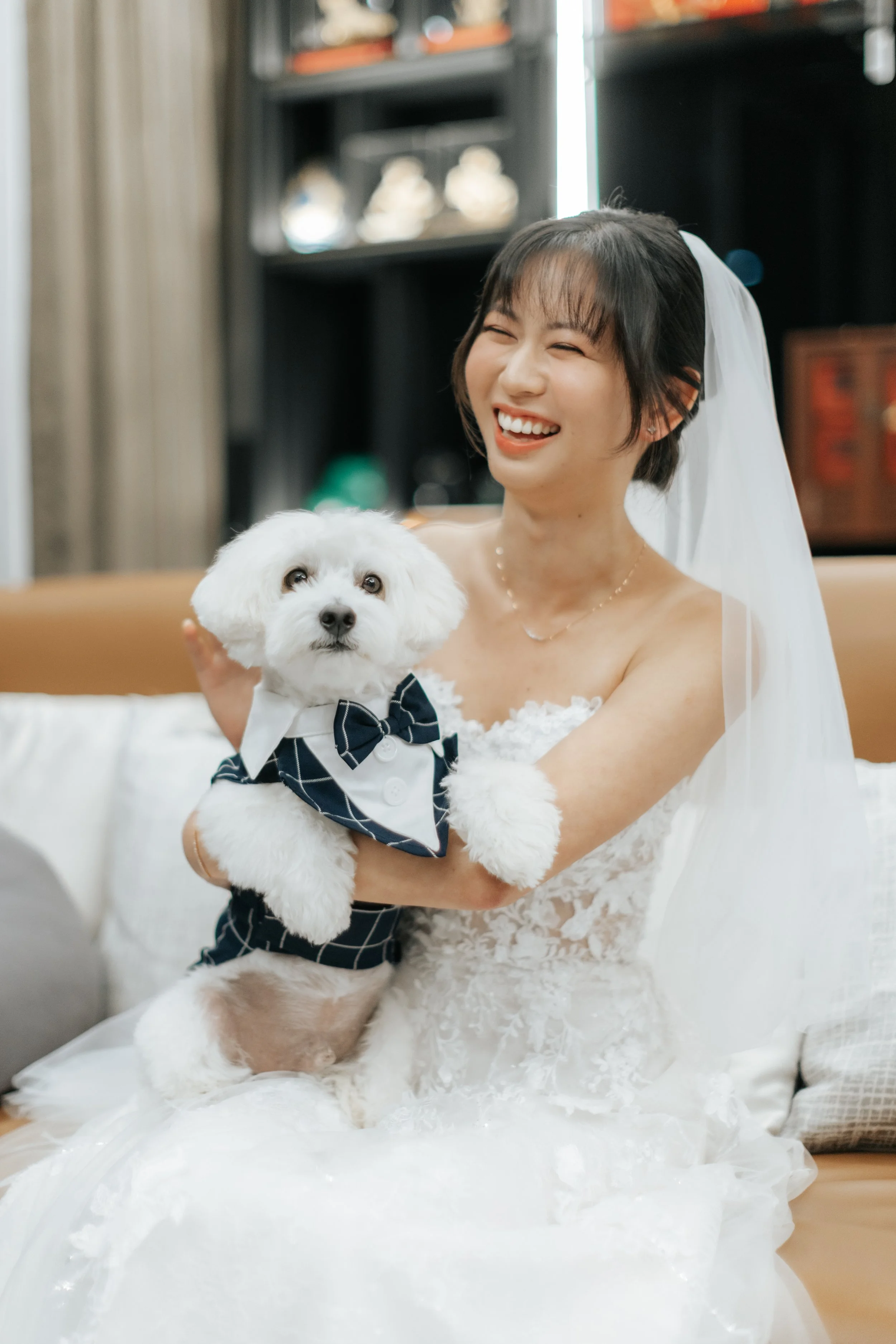 The bride-to-be poses with her cute pet dog on her actual wedding day as she waits for her groom to arrive. Photographed by Breadandbutterworks.