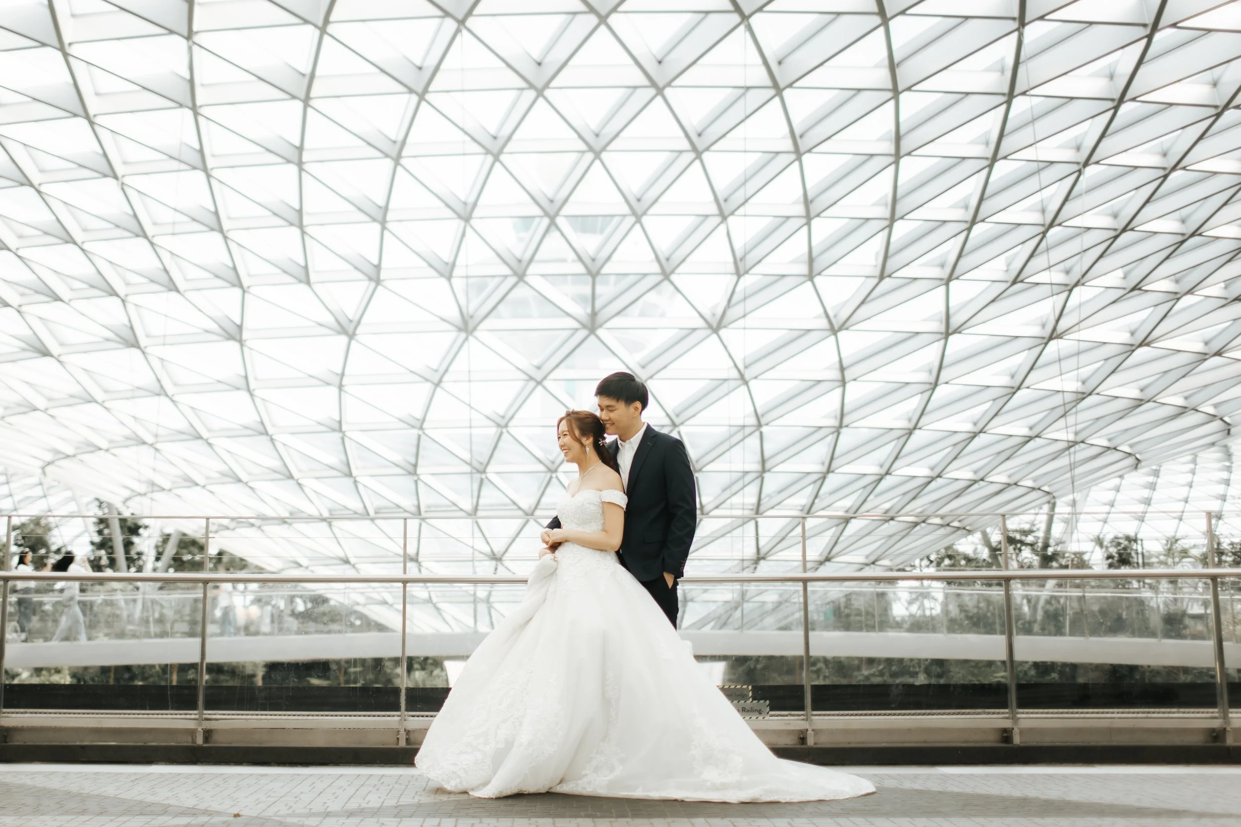 Light and romantic pre-wedding photoshoot at Changi Jewel, captured by Arielle for Breadandbutterworks.