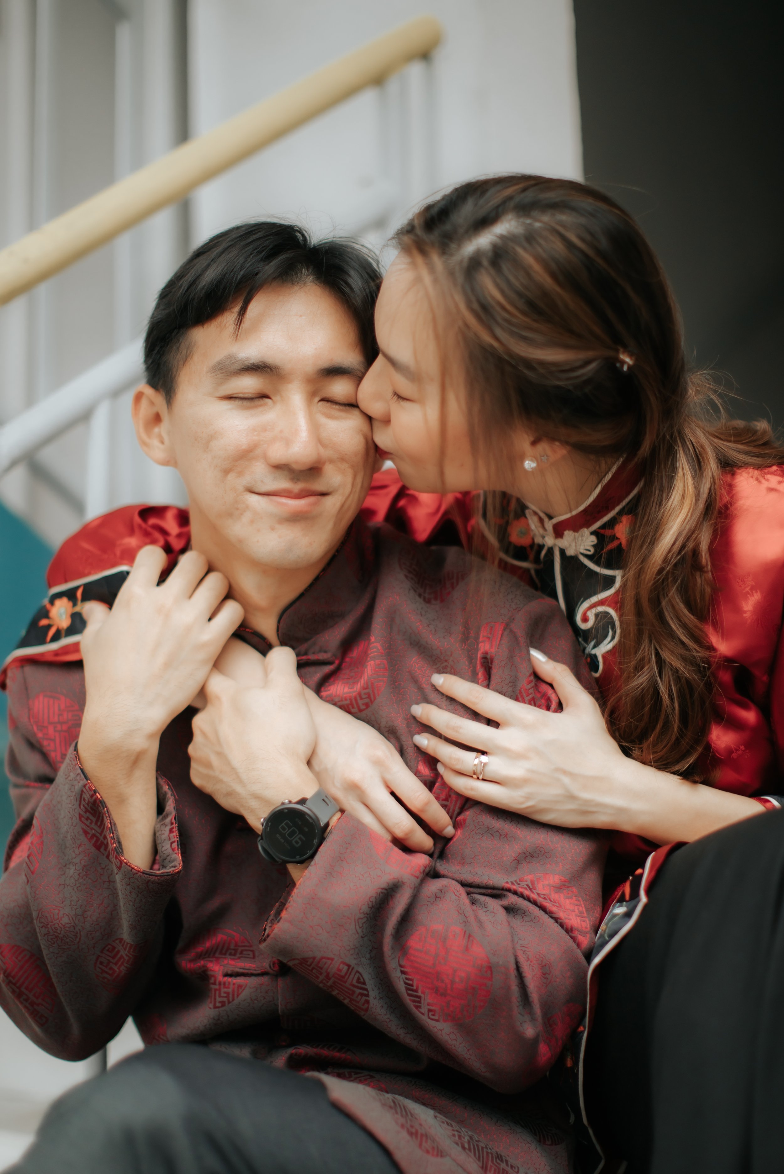 Light and airy pre-wedding photoshoot in the heartlands of Singapore, featuring the couple in traditional attire in Toa Payoh Estate. Captured by Ash for Breadandbutterworks.