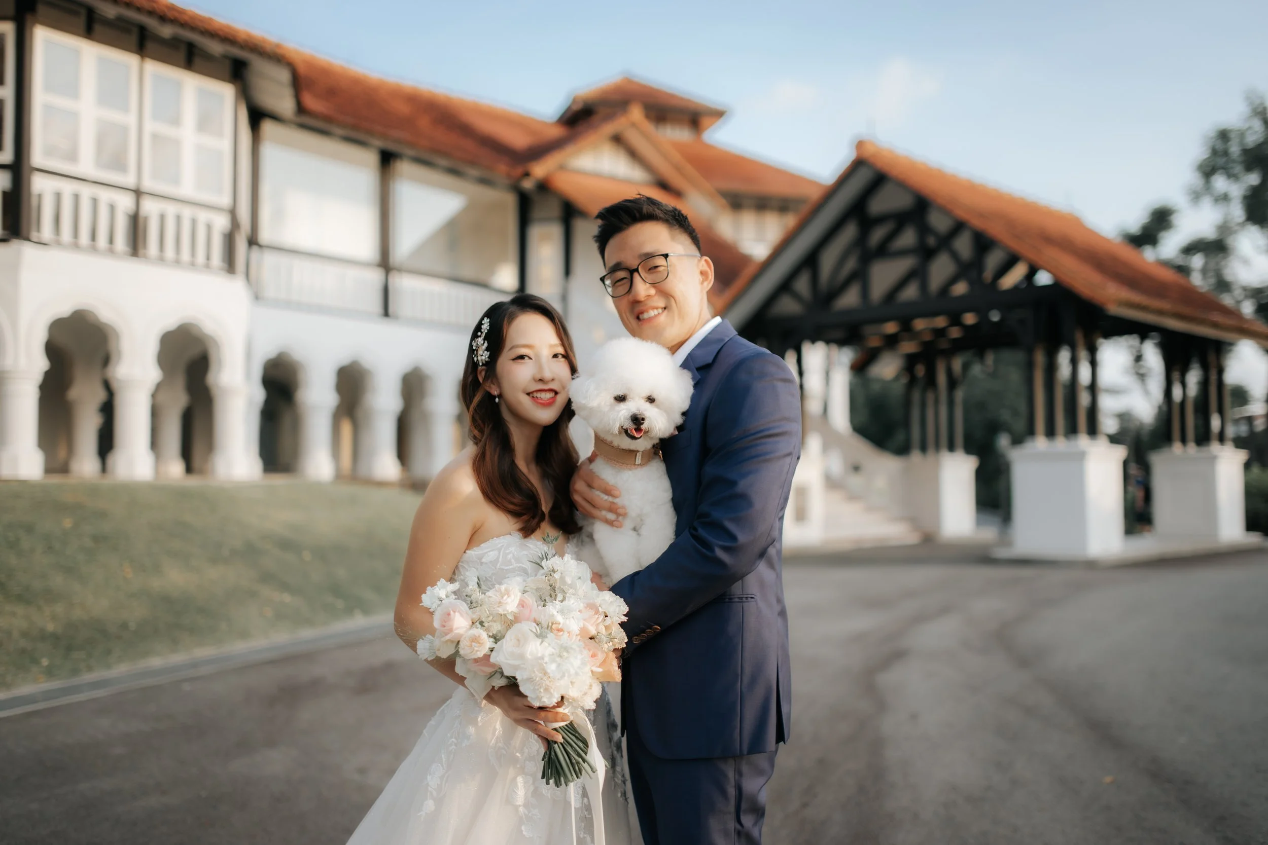 Light and airy pre-wedding photoshoot at Arwaa Mansion, featuring the couple and their pet dog with the colonial architecture as the backdrop. Captured by Ash for Breadandbutterworks.