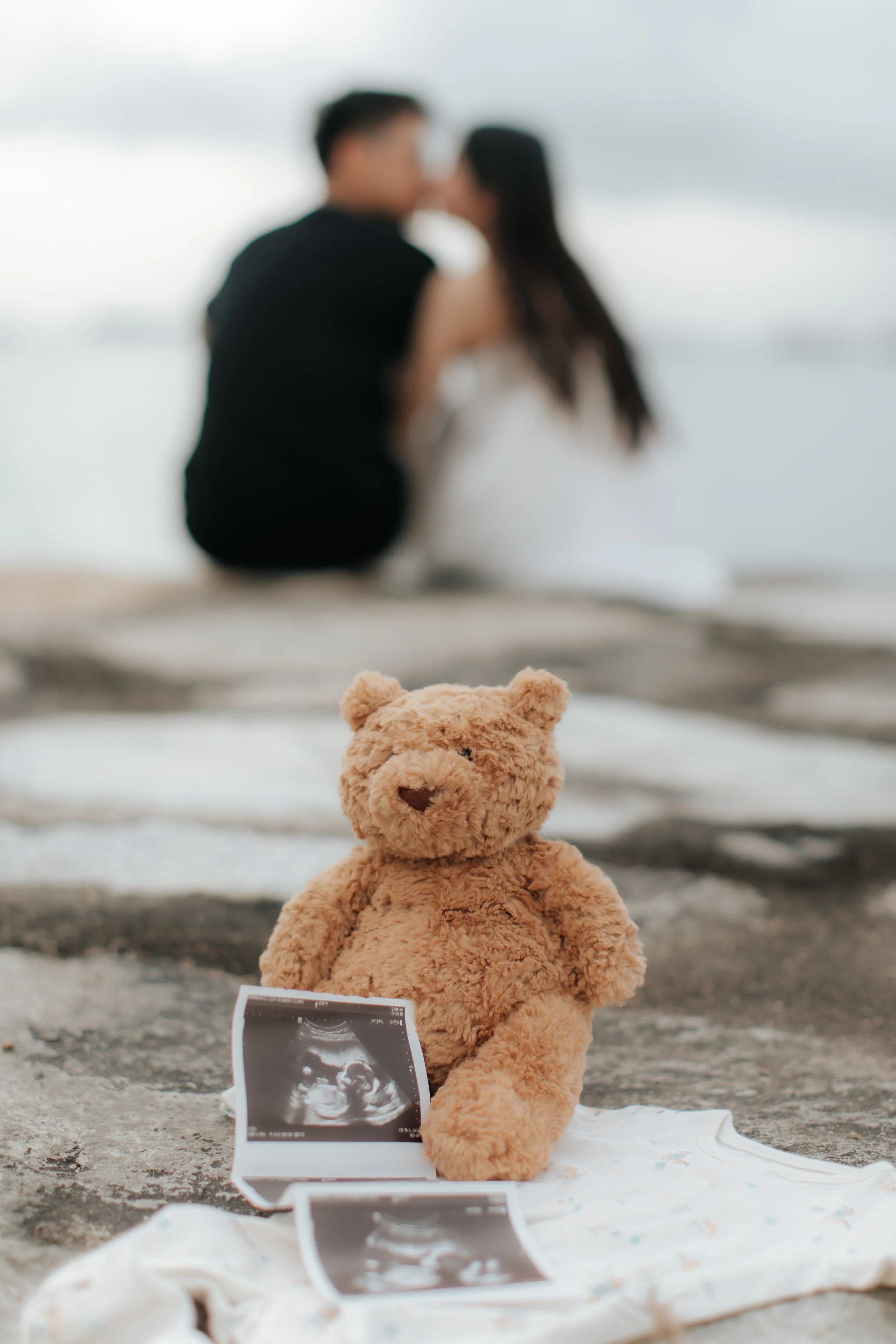 Cinematic maternity shoot at sunset at East Coast Park in Singapore, captured by Arielle for Breadandbutterworks.