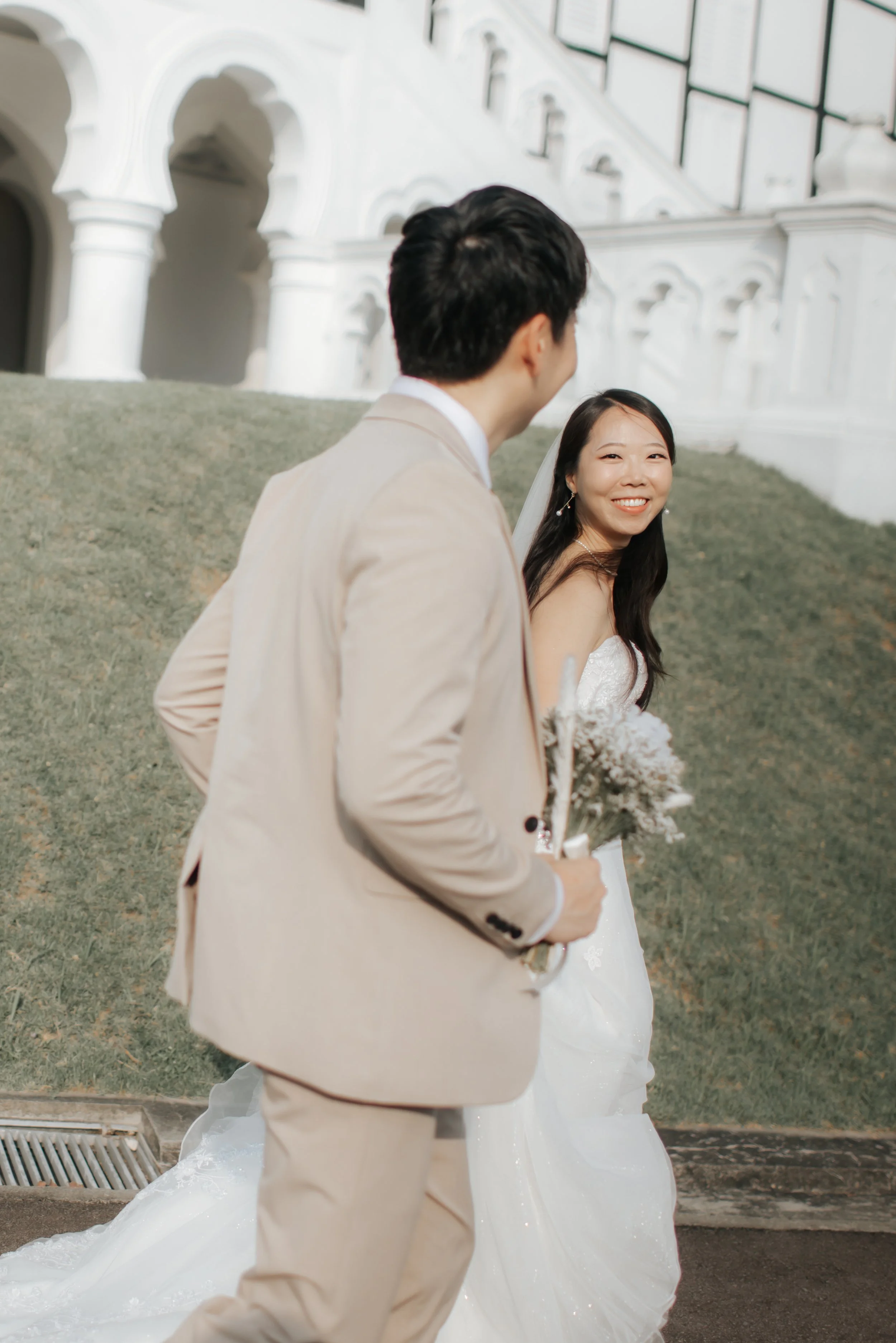 Light and airy pre-wedding photoshoot of a couple at Bandstand and Gallop Extension in Singapore. Captured by Arielle from Breadandbutterworks.