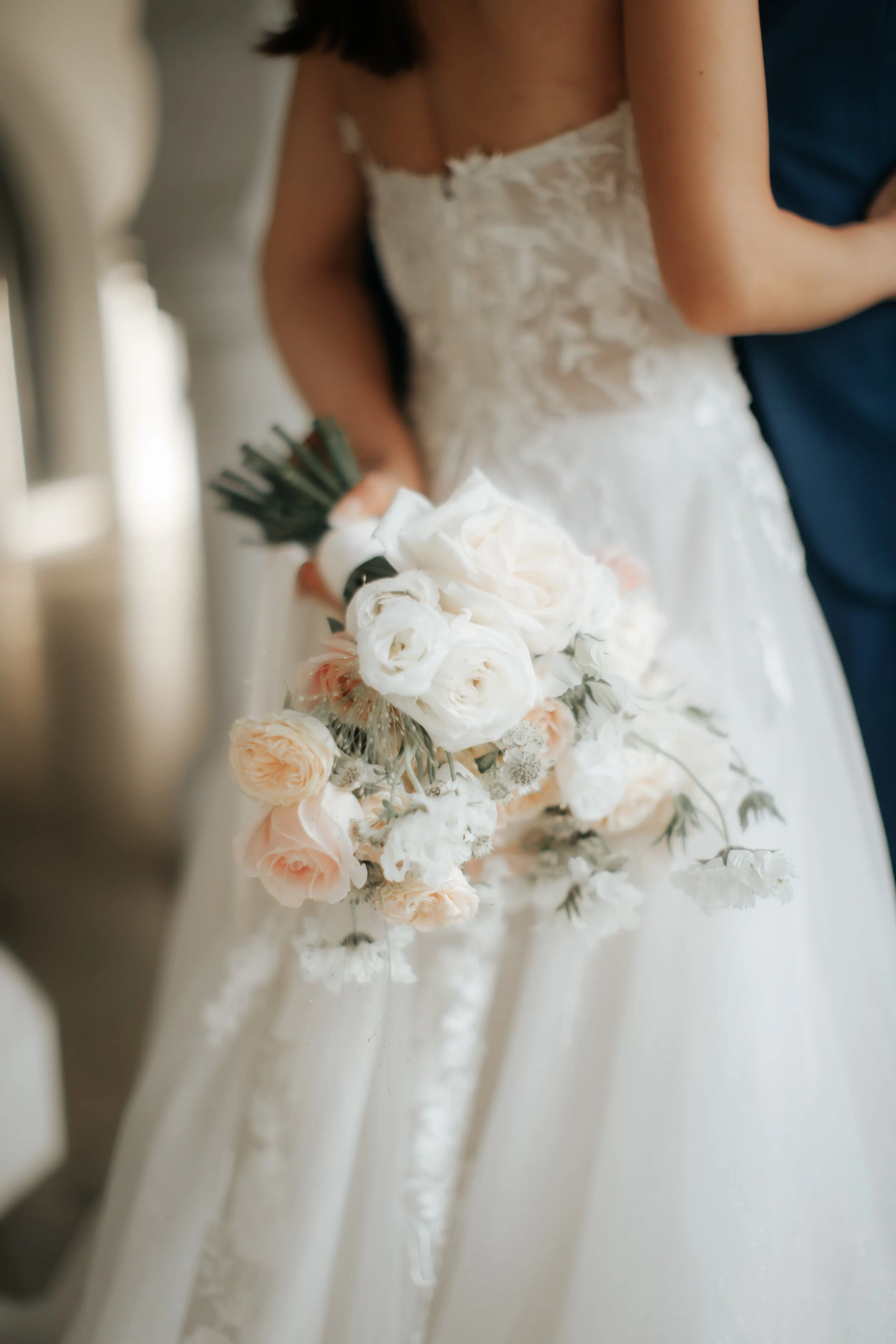 Light and airy pre-wedding photoshoot at Arwaa Mansion, featuring an artistic close-up on the bouquet within the colonial architecture. Captured by Ash for Breadandbutterworks.