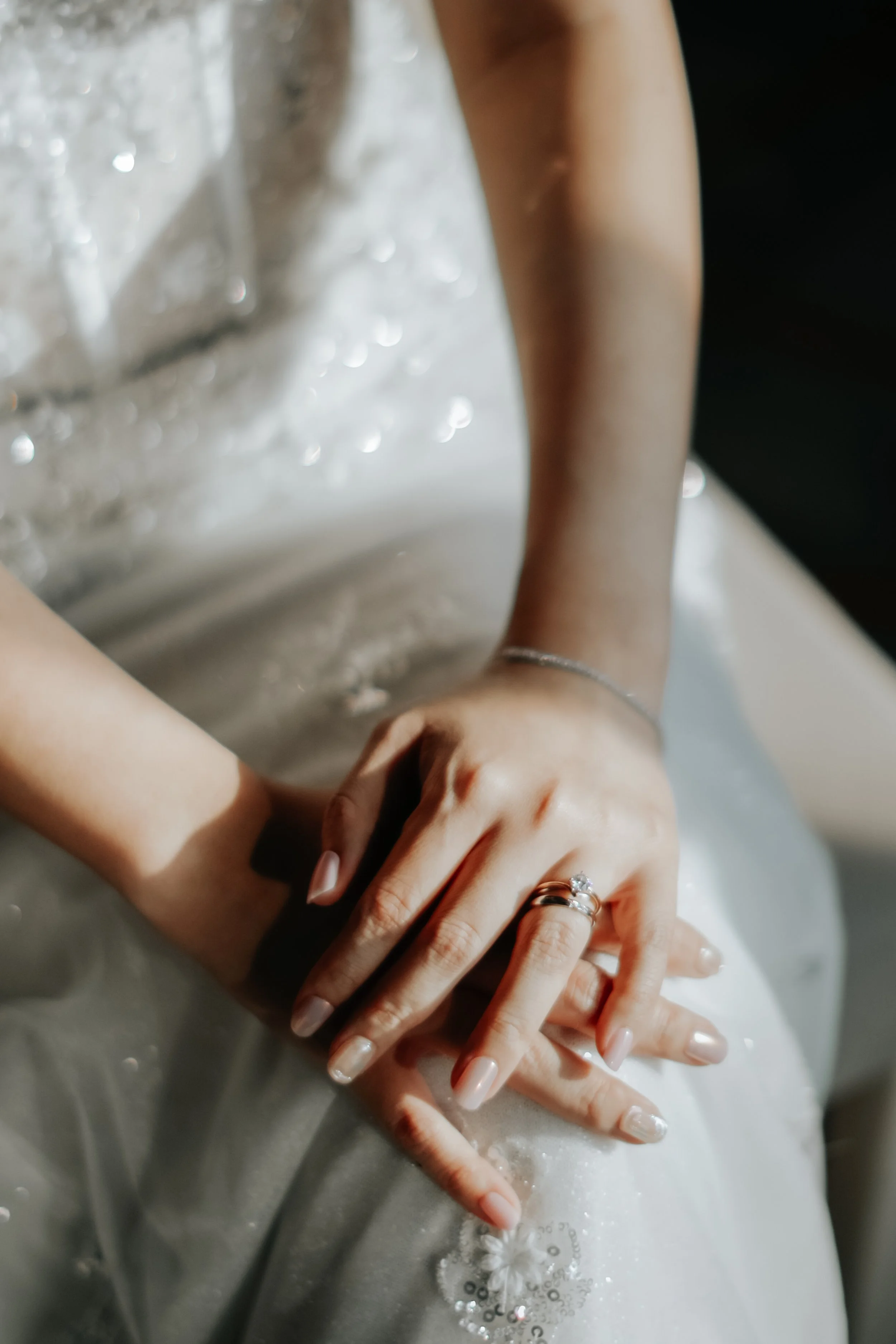 Detail shot of a bride-to-be, featuring her engagement ring, wedding gown and manicure. Captured in a light and airy style by Arielle for Breadandbutterworks.