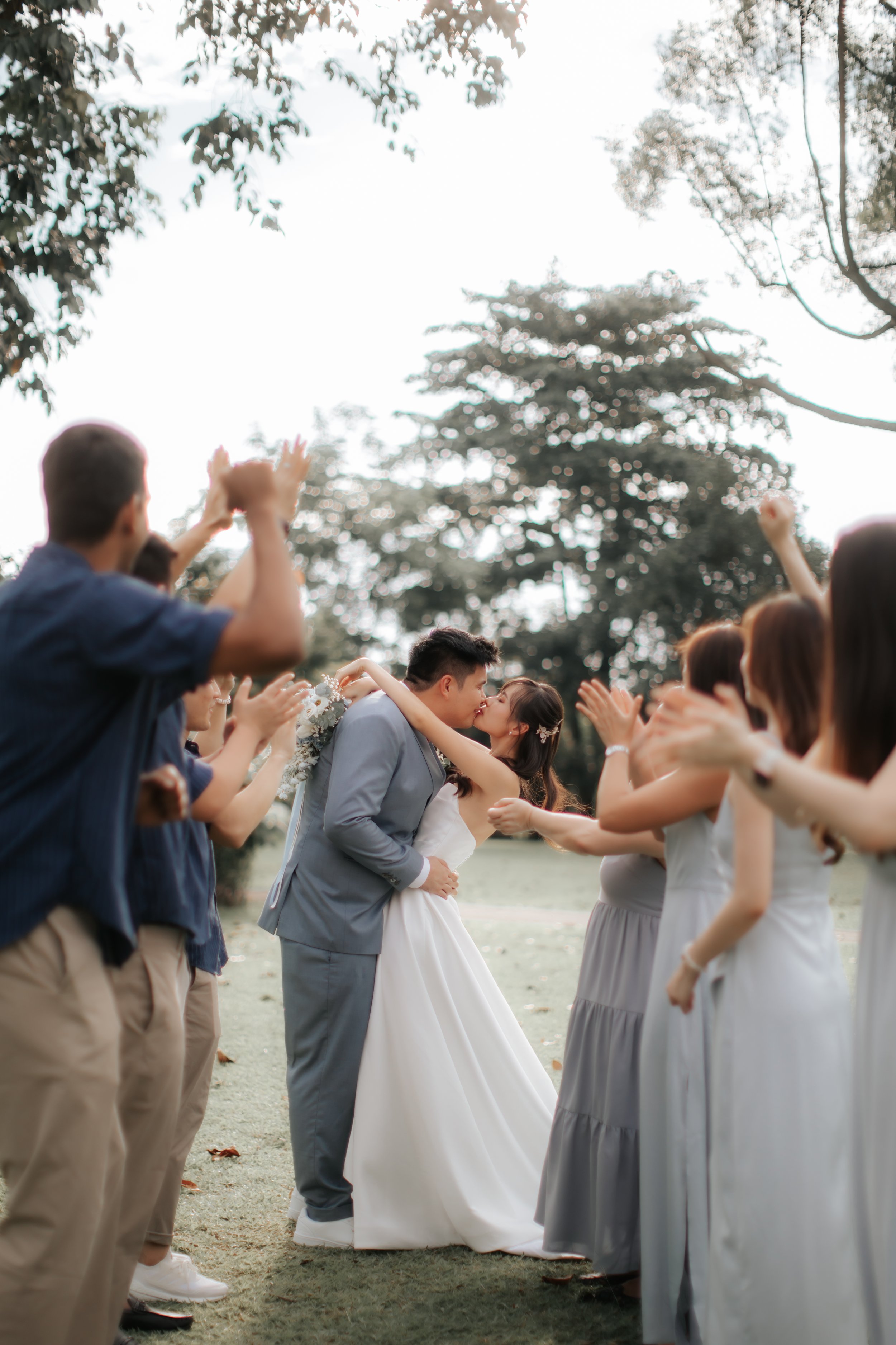 Light and airy actual day wedding photoshoot at Wheeler's Estate and East Coast Park in Singapore. Captured by Ash for Breadandbutterworks. 