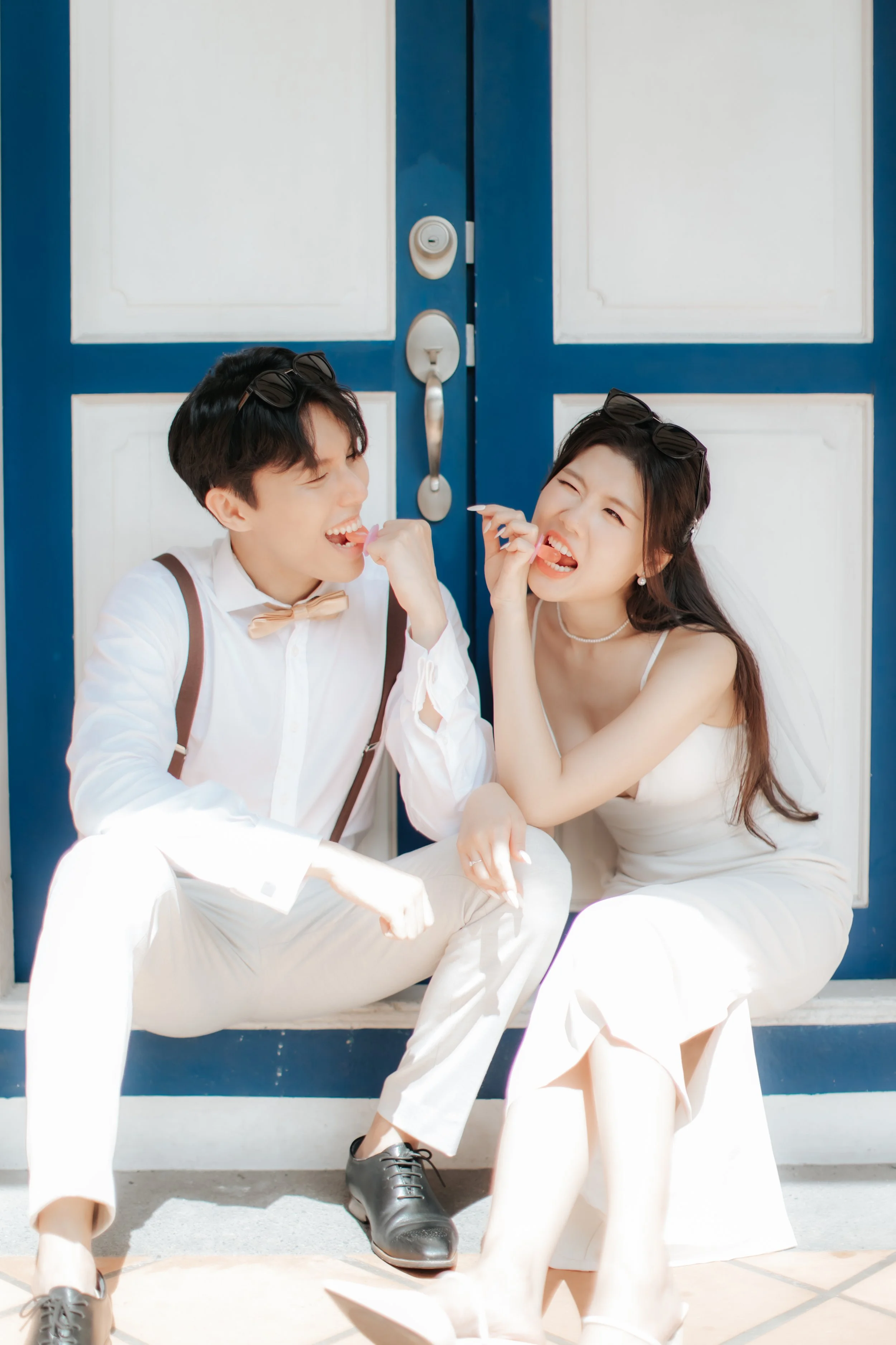 Light and airy pre-wedding photoshoot of a cheerful colour at Keong Siak Street in Singapore, captured by Arielle for Breadandbutterworks.