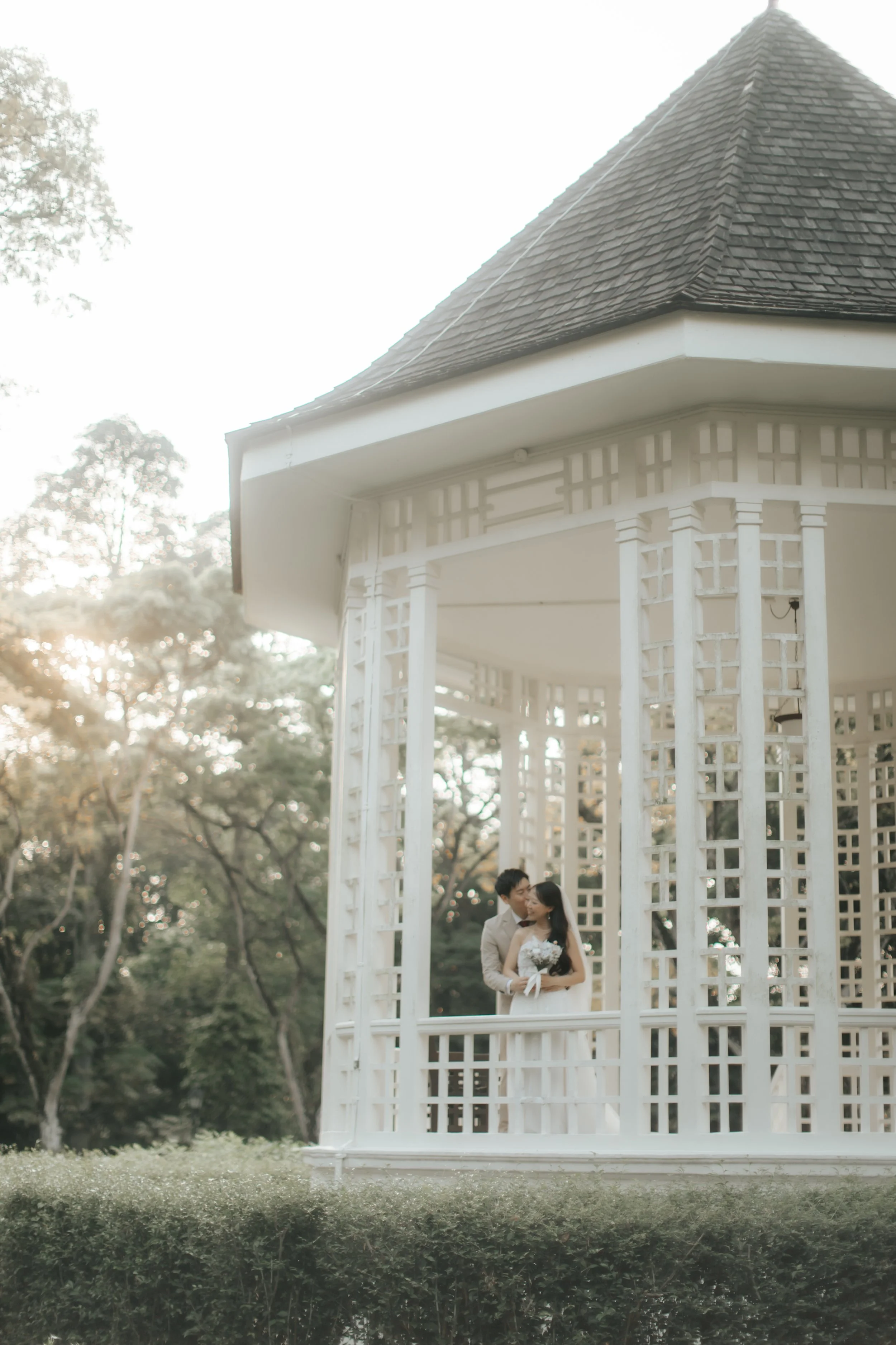 Light and airy pre-wedding photoshoot of a couple at Bandstand and Gallop Extension in Singapore. Captured by Arielle from Breadandbutterworks.