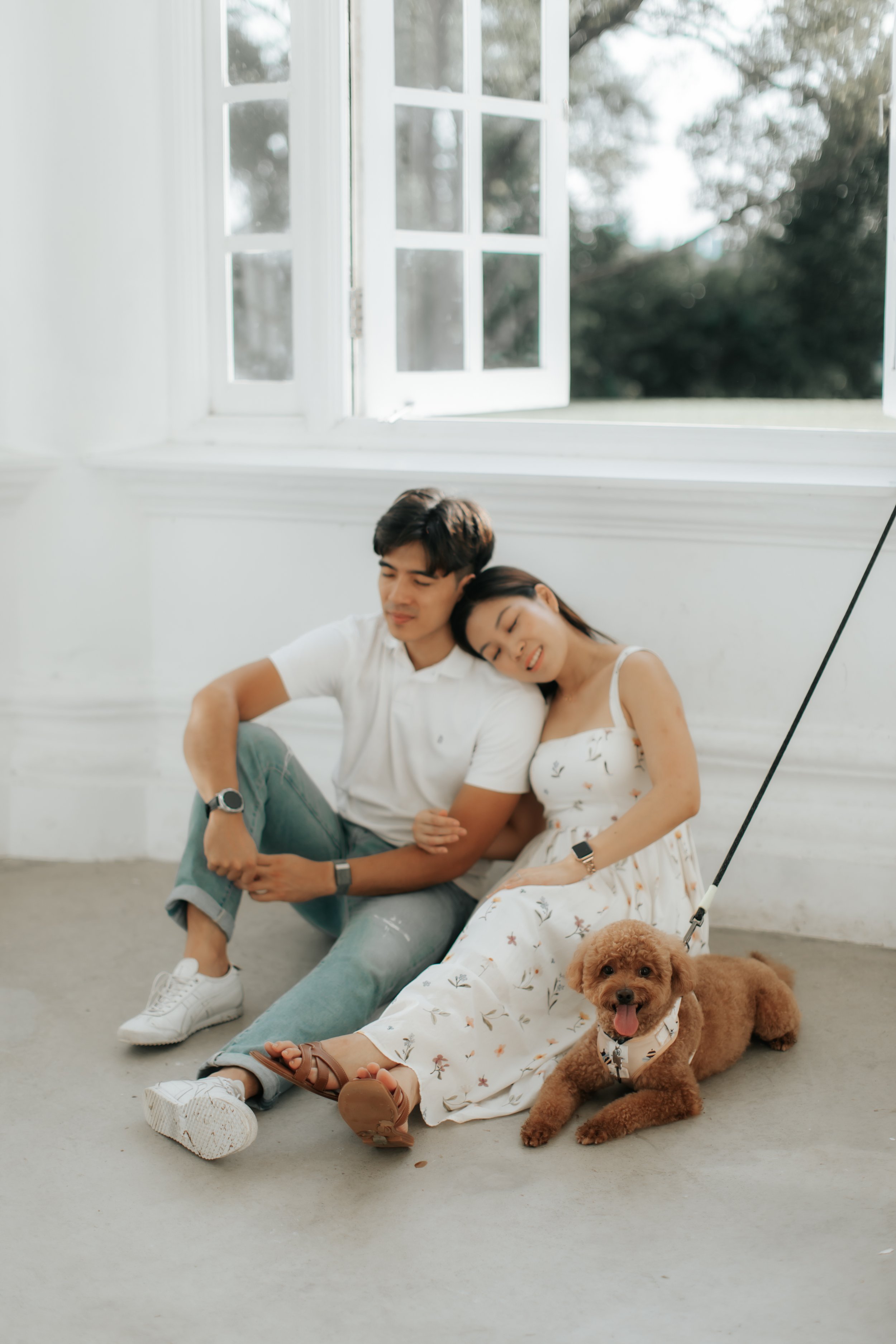 Light and airy pre-wedding photoshoot with pet dog relaxing indoors at Gallop Extension. Captured by Breadandbutterworks.