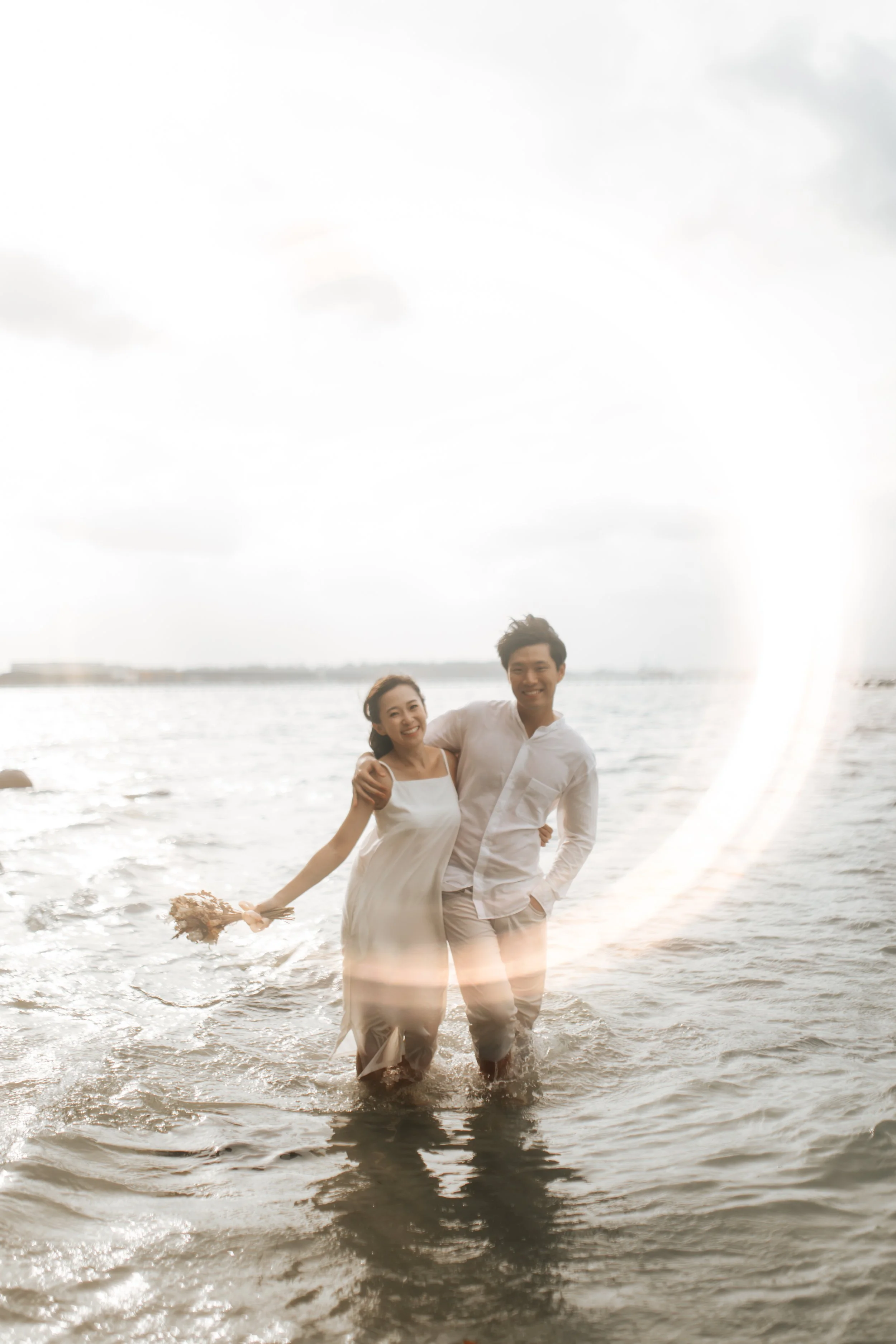 Relaxed and natural beach pre-wedding photoshoot at Punggol Beach in Singapore, captured by Arielle for Breadandbutterworks.