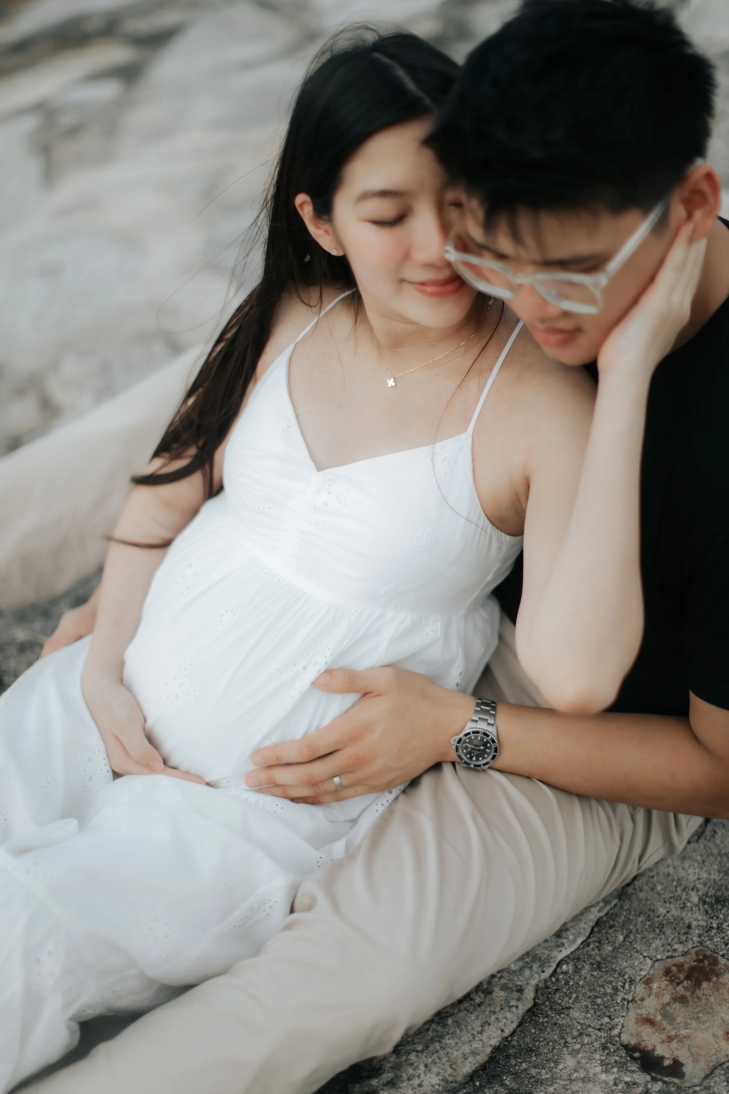 Intimate maternity shoot at sunset at East Coast Park in Singapore, captured by Arielle for Breadandbutterworks.