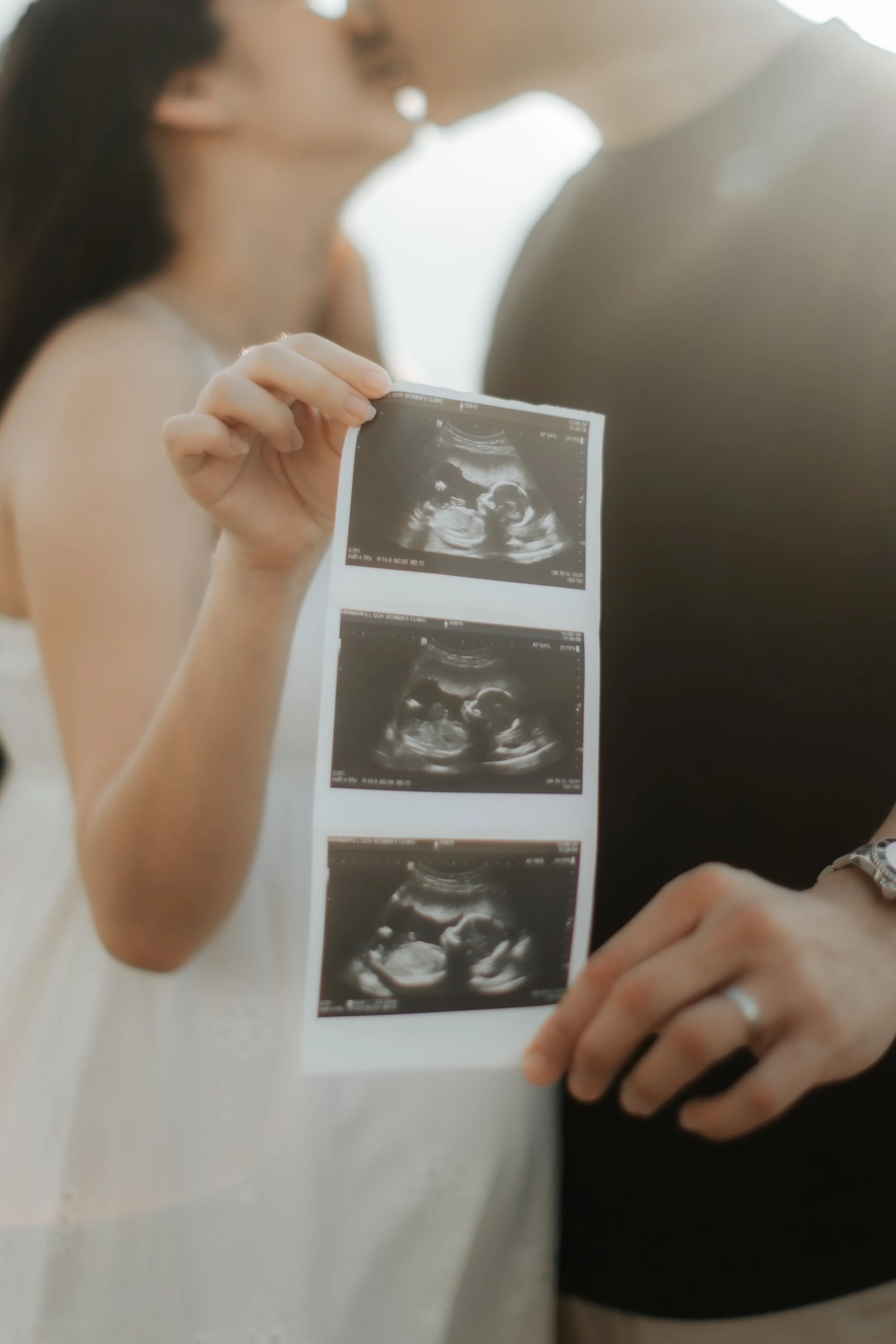 Intimate close-up maternity shoot at sunset at East Coast Park in Singapore, captured by Arielle for Breadandbutterworks.