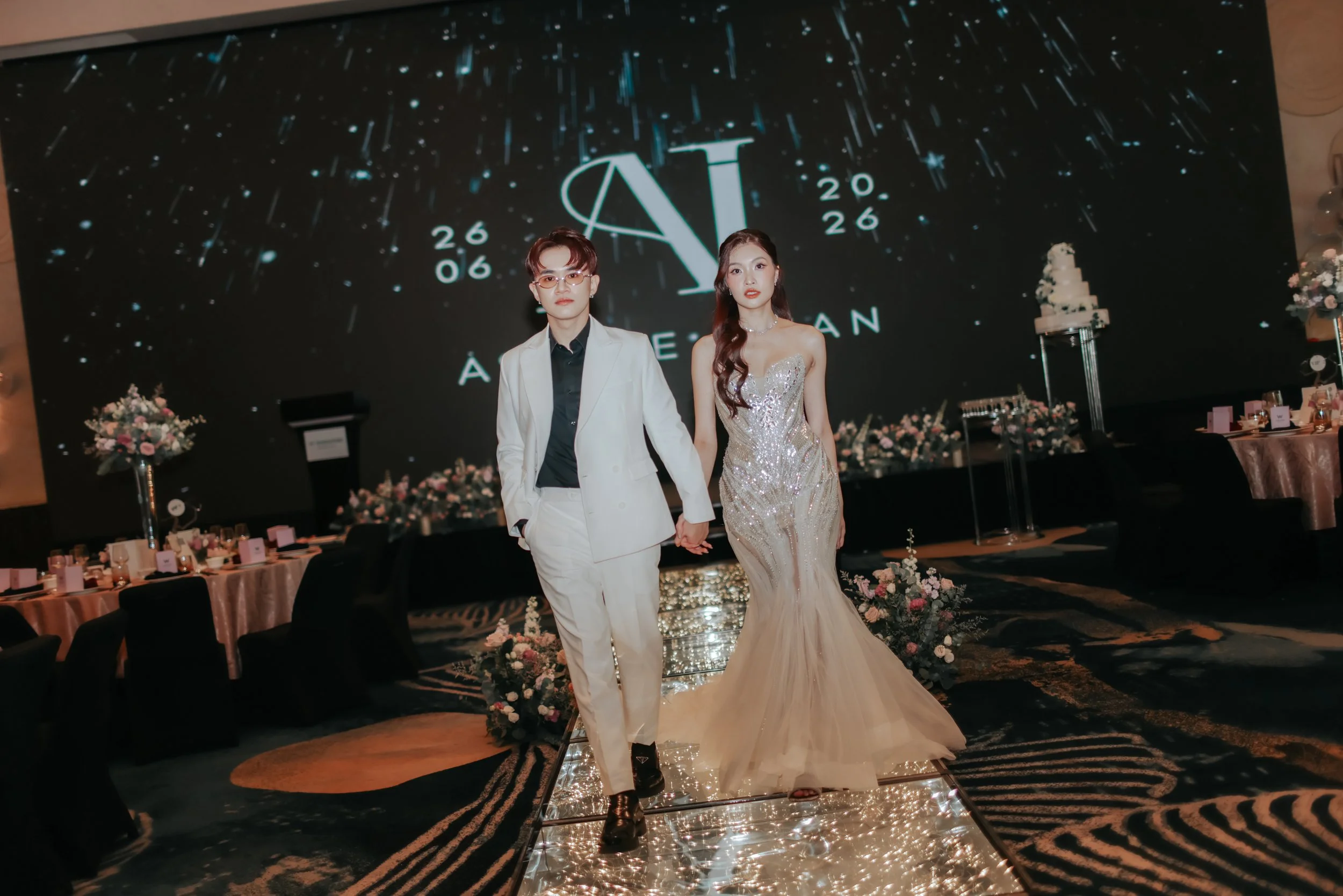 Actual day wedding photoshoot at W Hotel, the bride and groom walks down the aisle at the wedding venue looking stunning in their outfits. Captured by Arielle from Breadandbutterworks.