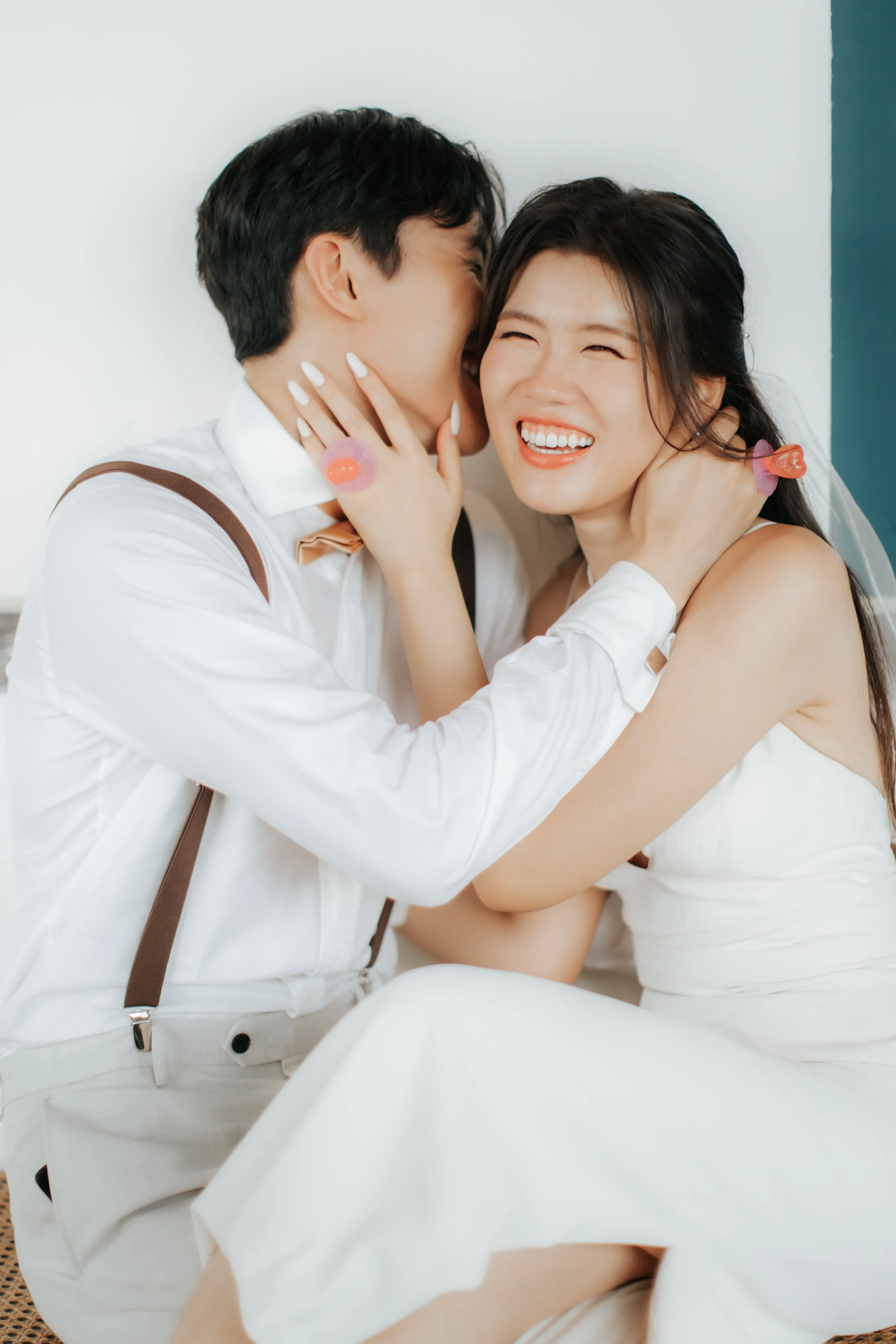 Light and airy pre-wedding photoshoot of a cheerful colour at Keong Siak Street in Singapore, captured by Arielle for Breadandbutterworks.