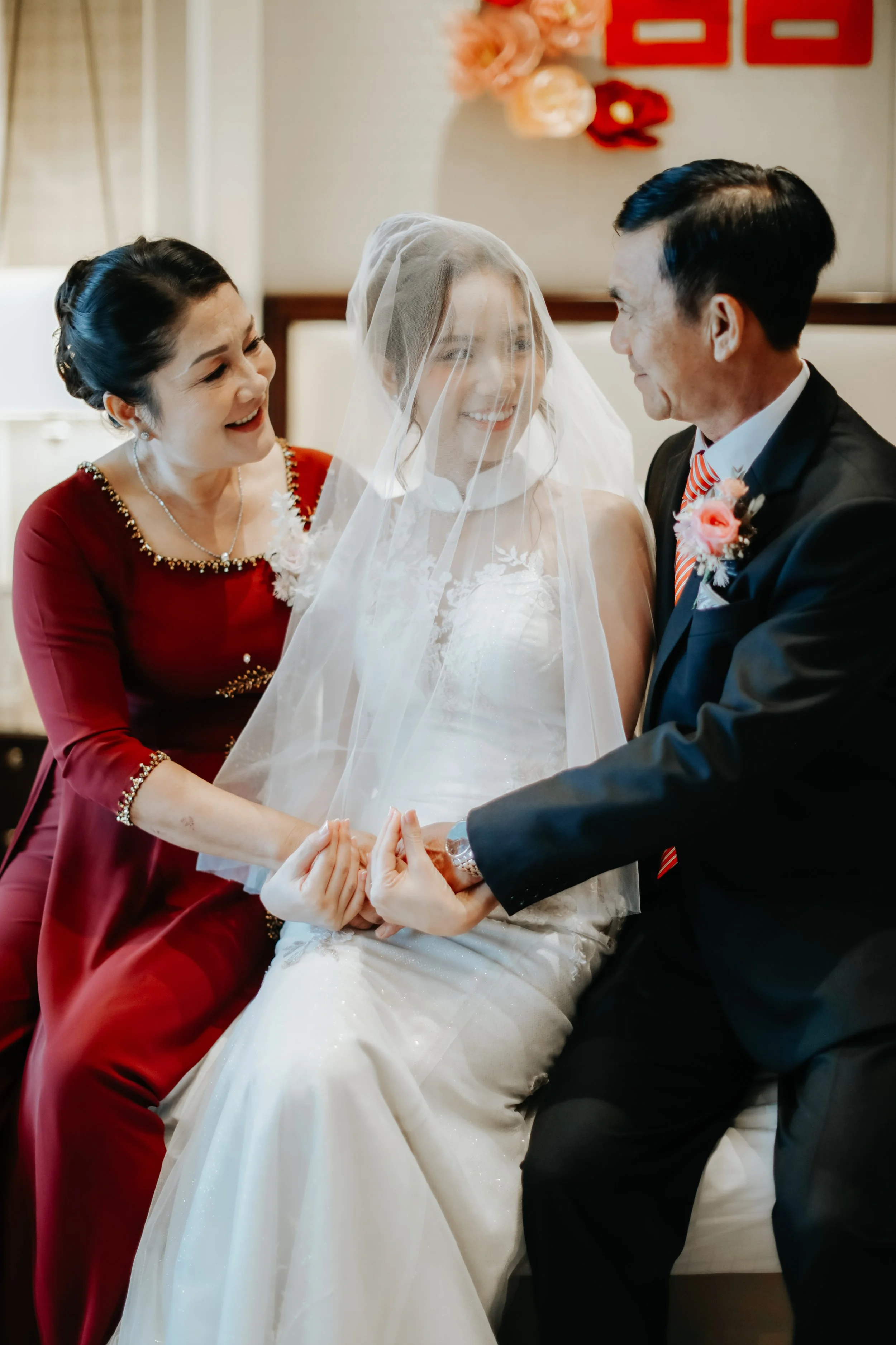 Light and airy actual day wedding photoshoot of the bride-to-be and her parents just after getting veiled. Captured by Arielle for Breadandbutterworks.