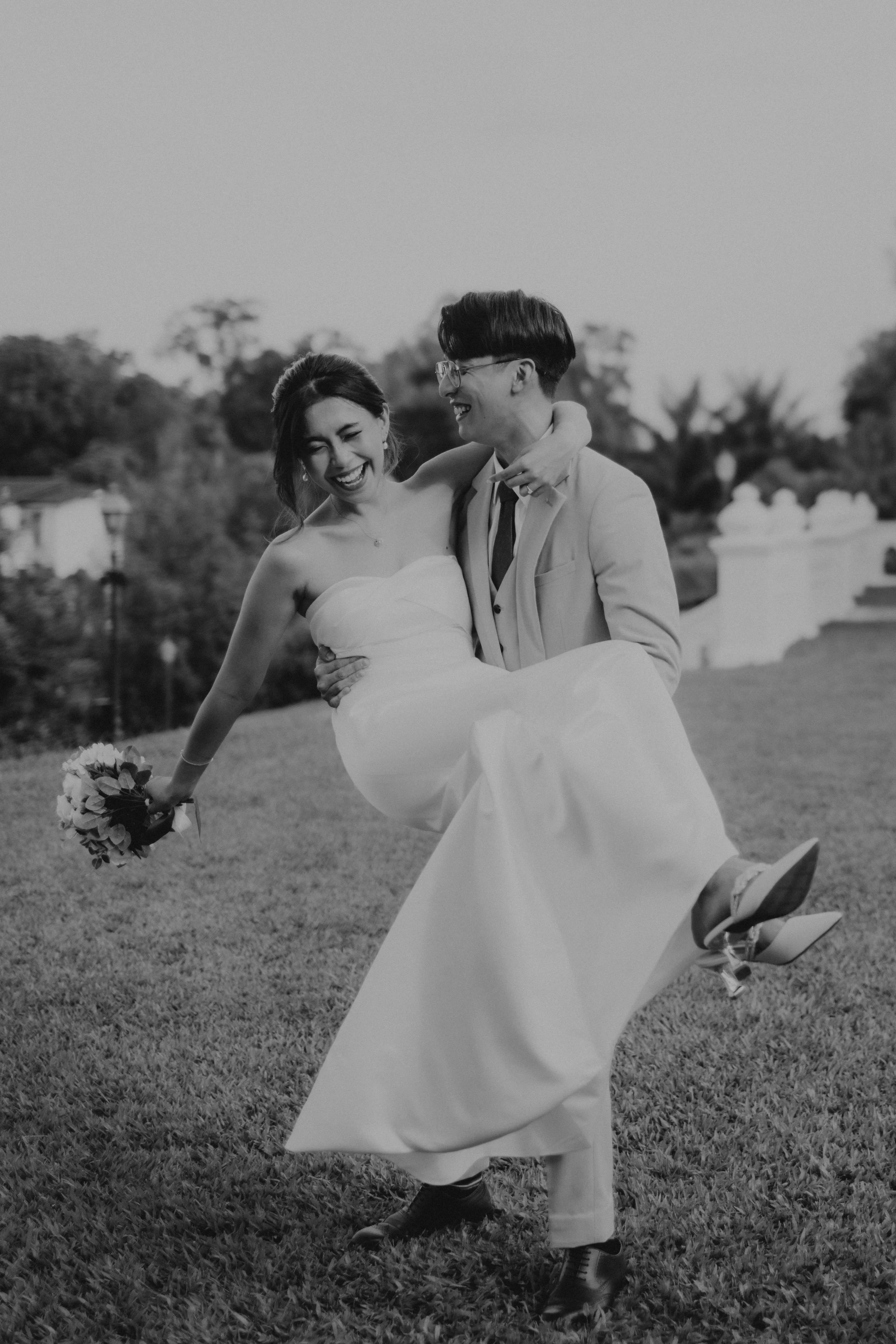 Creative black and white bride and groom pre-wedding photoshoot at Canterbury Road in Singapore. Captured in a light and airy style by Arielle for Breadandbutterworks.