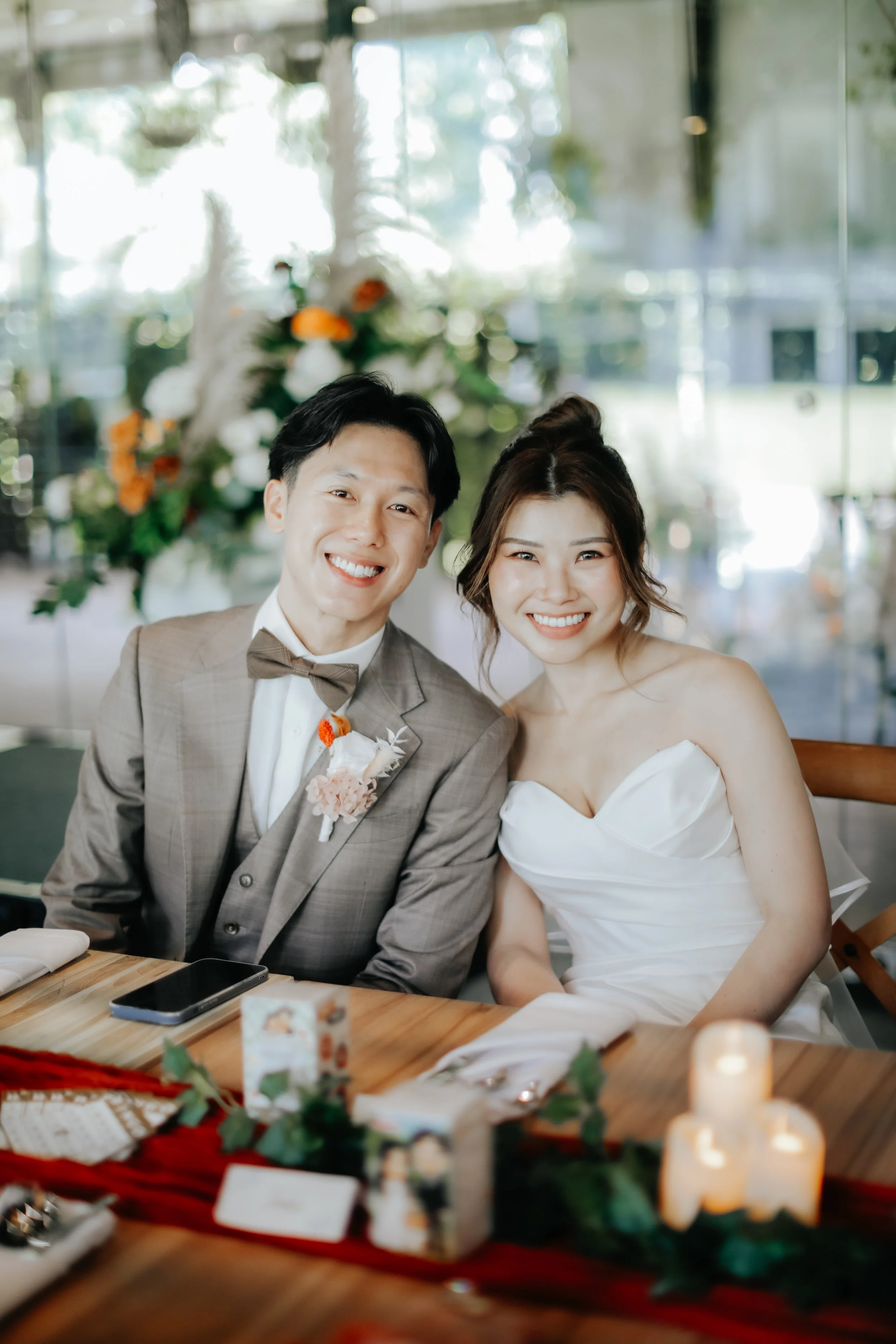 Light and airy actual day wedding photoshoot at Canopy HortPark, the couple pose before their meal. Captured by Arielle from Breadandbutterworks.