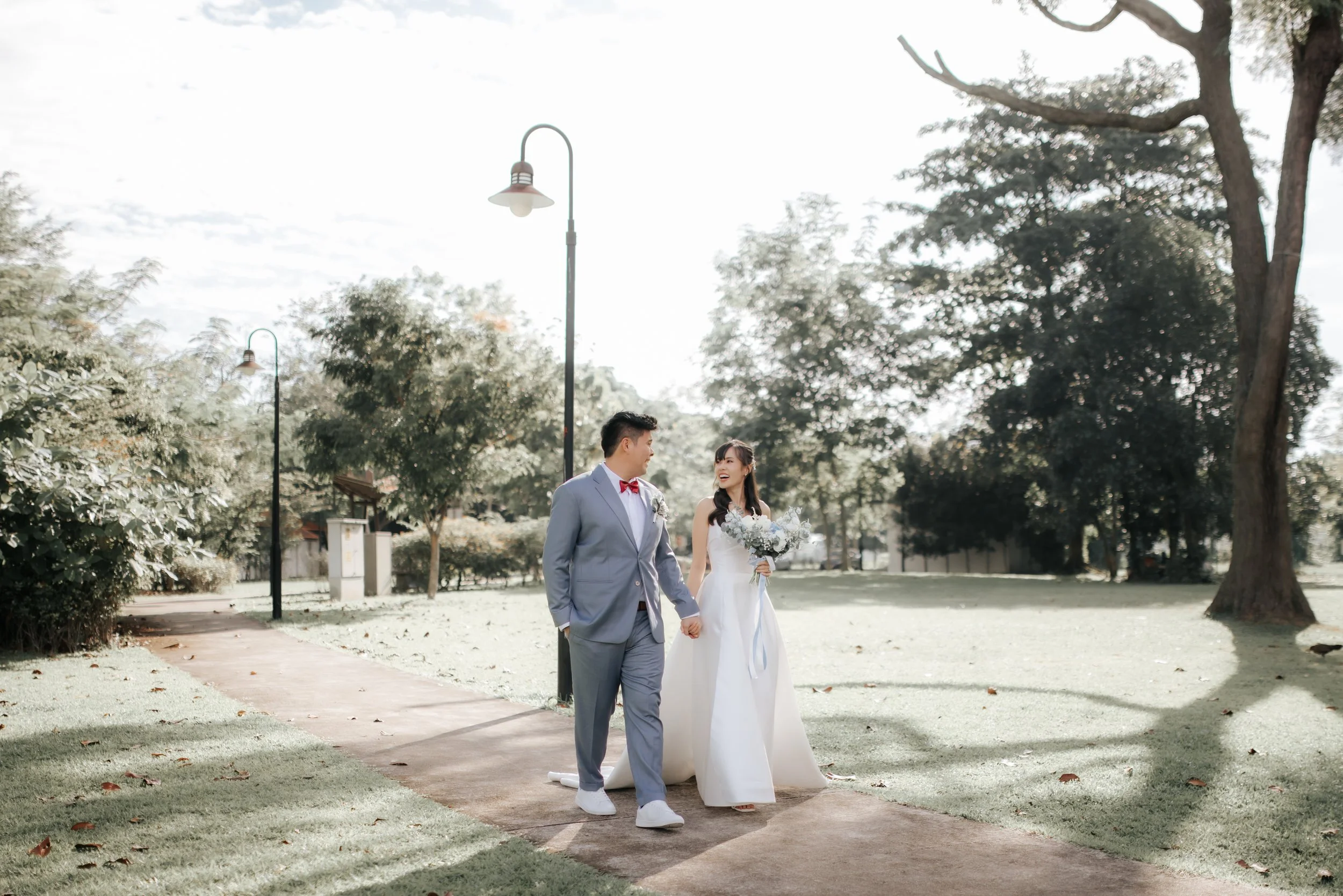Light and airy actual day wedding photoshoot at Wheeler's Estate and East Coast Park in Singapore. Captured by Ash for Breadandbutterworks. 