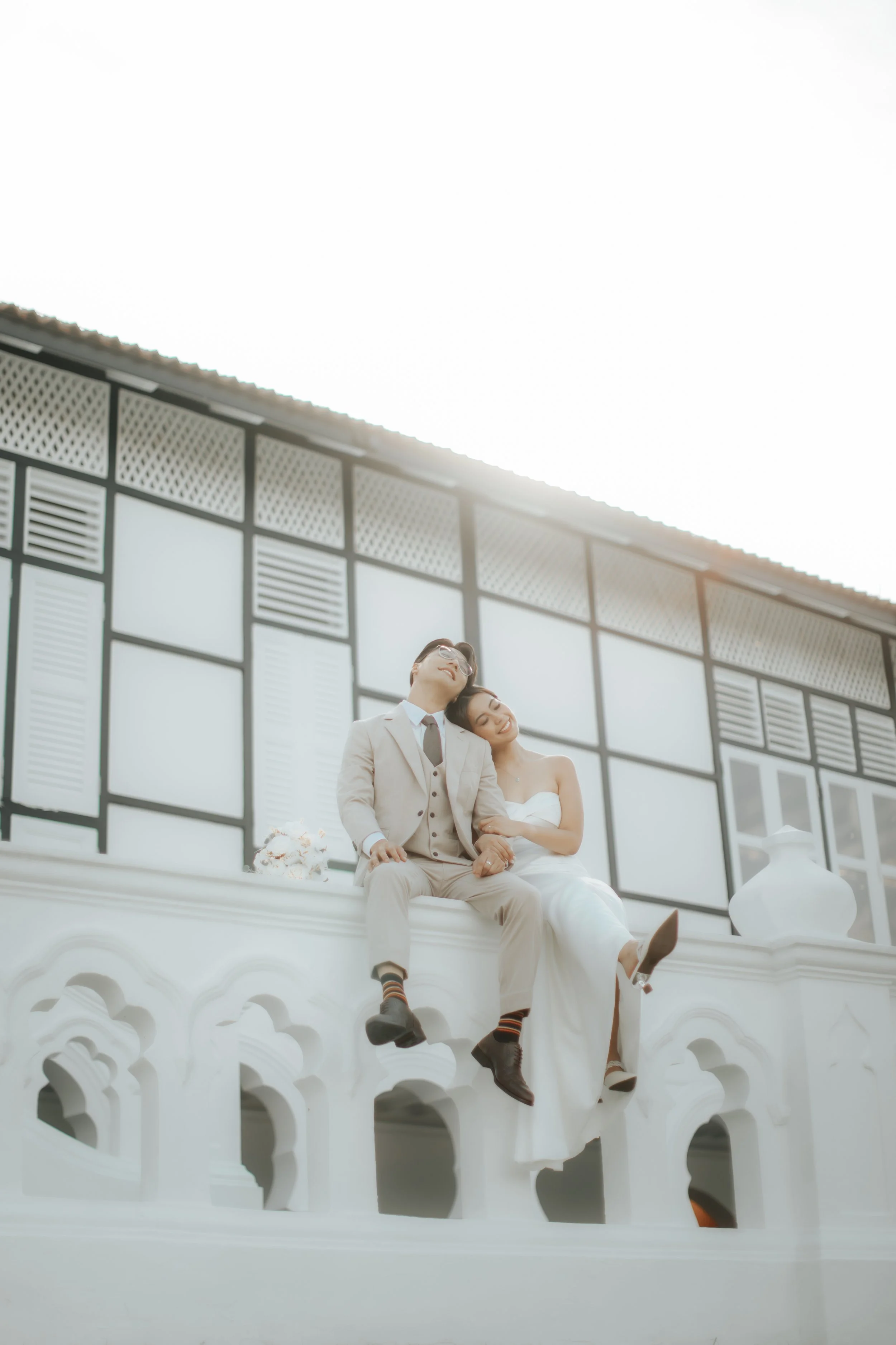 Gorgeous bride and groom pre-wedding photoshoot at Gallop Extension in Singapore. Captured in a light and airy style by Arielle for Breadandbutterworks.