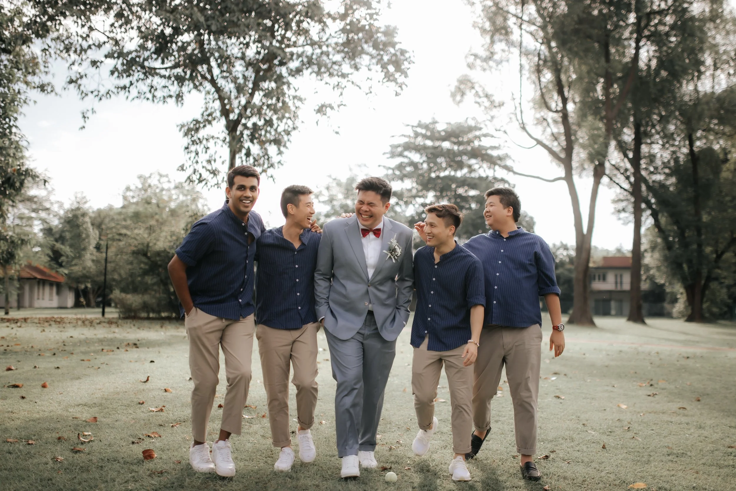 Light and airy actual day wedding photoshoot at Wheeler's Estate and East Coast Park in Singapore of the groom and his groomsmen. Captured by Ash for Breadandbutterworks. 