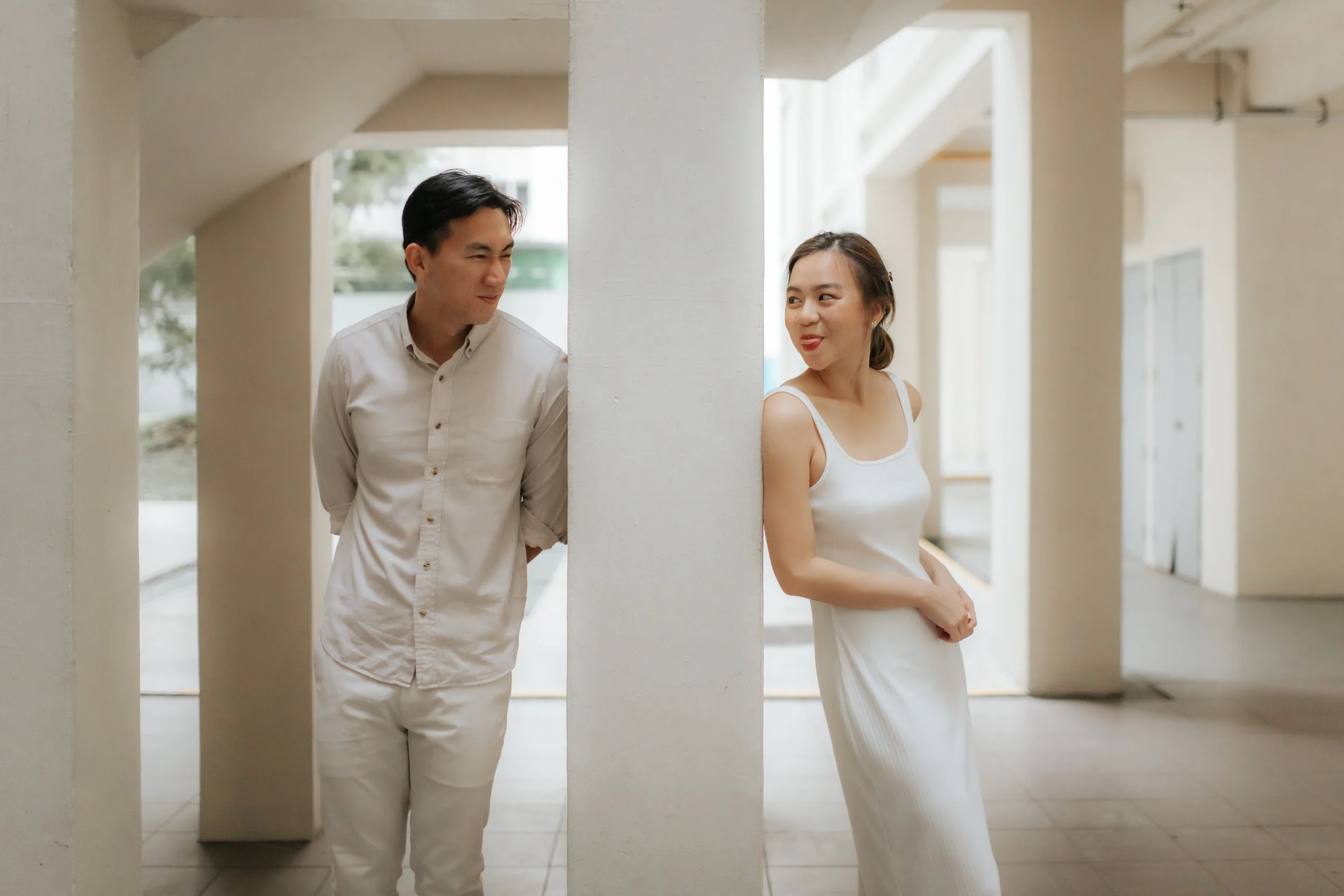 Light and airy pre-wedding photoshoot in the heartlands of Singapore, featuring Toa Payoh Estate. Captured by Ash for Breadandbutterworks.