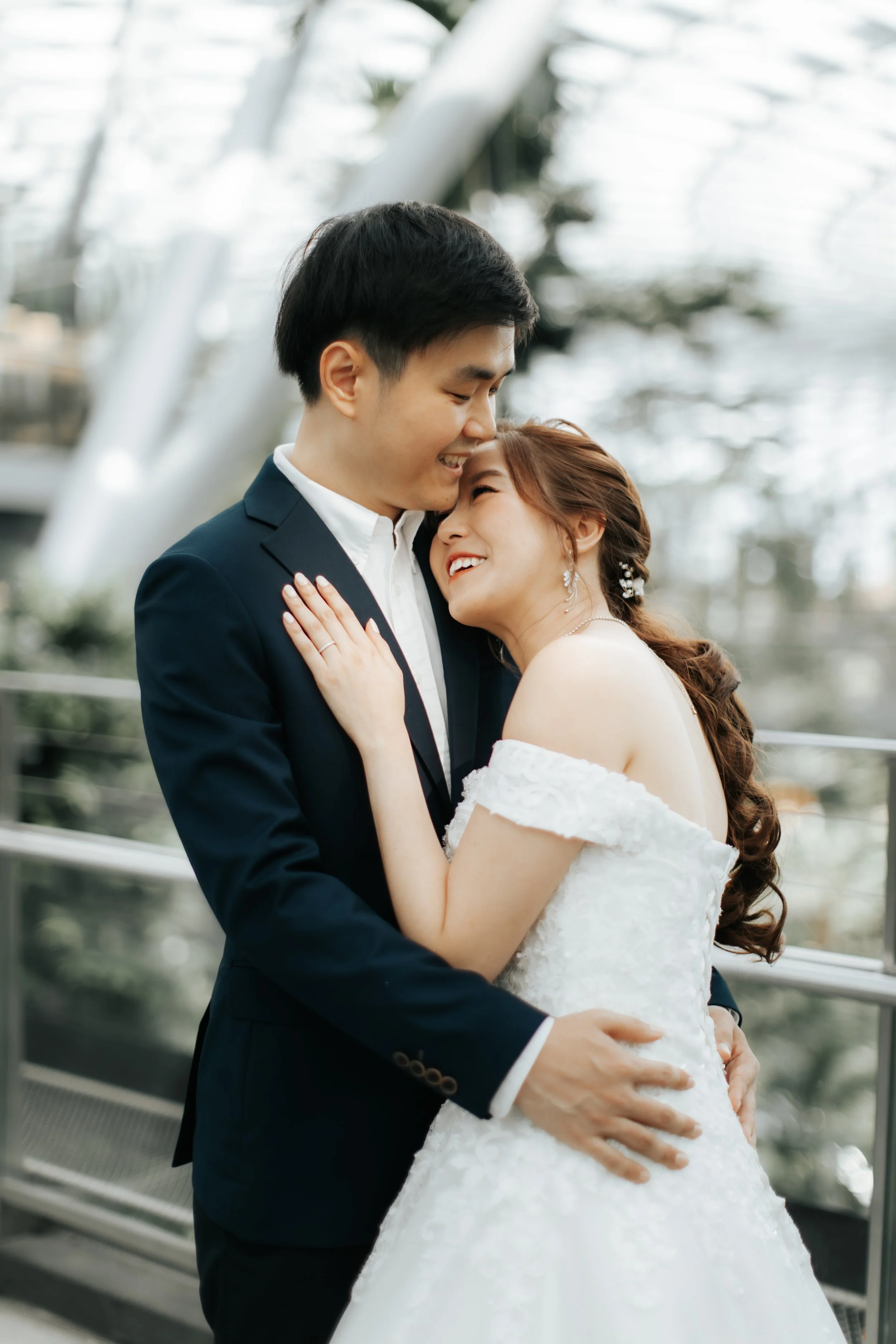 Light and romantic pre-wedding photoshoot at Changi Jewel, captured by Arielle for Breadandbutterworks.