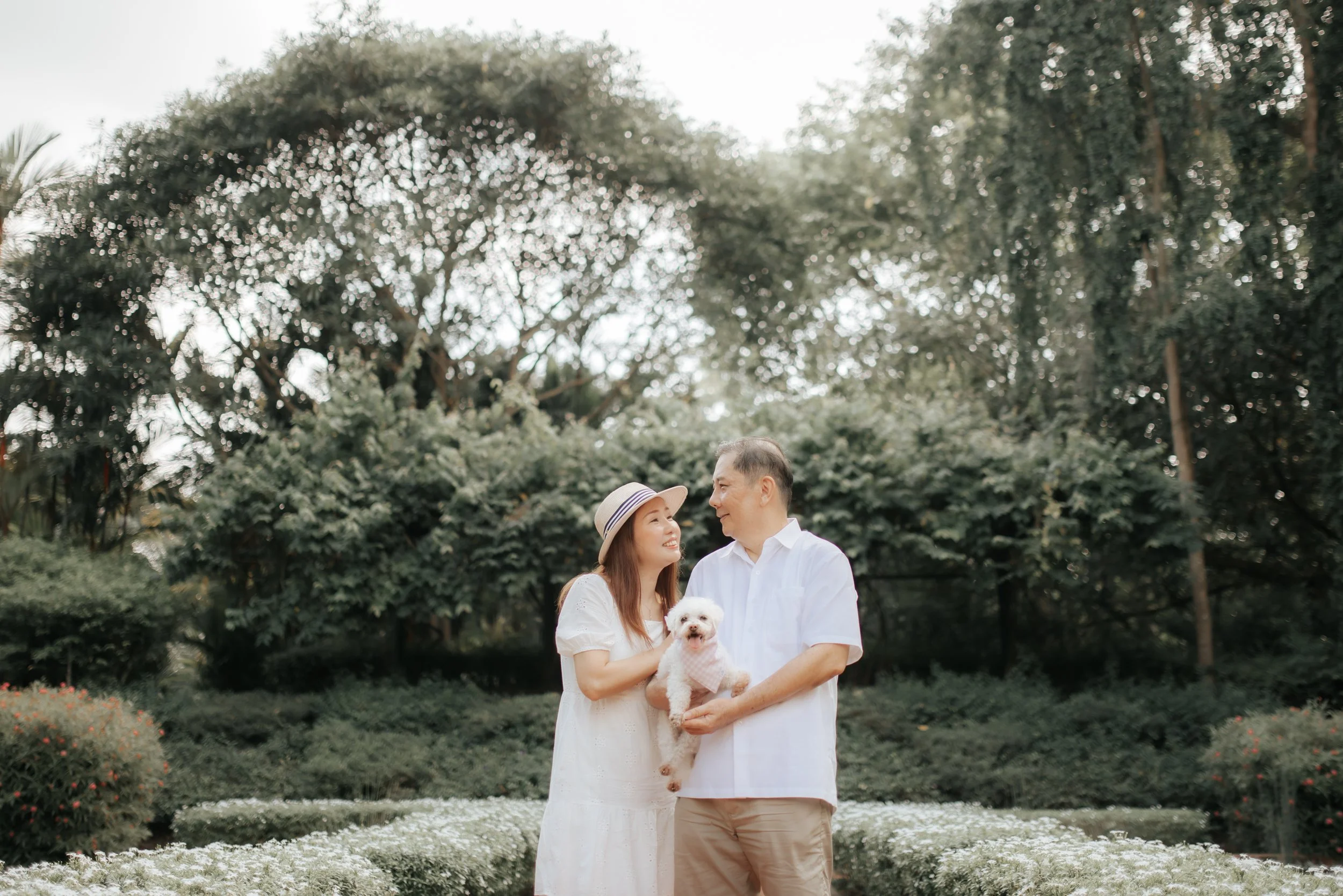 Light and airy family photoshoot in Singapore featuring the couple's parents, captured by Breadandbutterworks.
