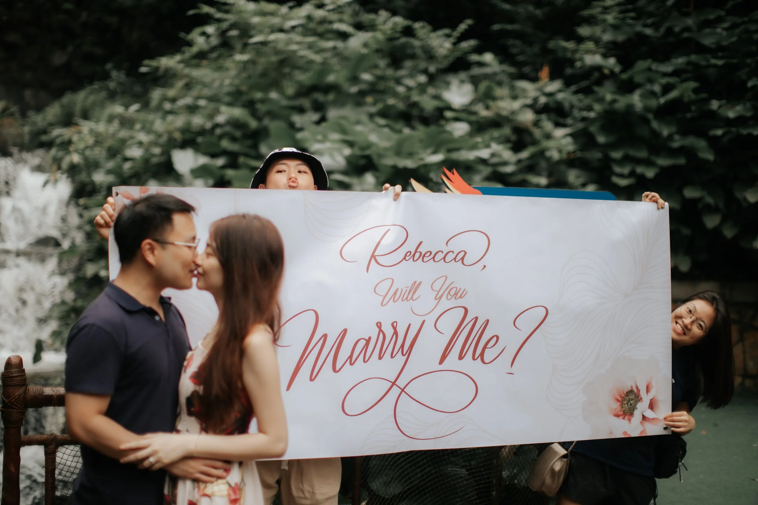Romantic proposal photoshoot at Jurong Bird Park (now known as Bird Paradise) in Singapore, captured by Ash from Breadandbutterworks.