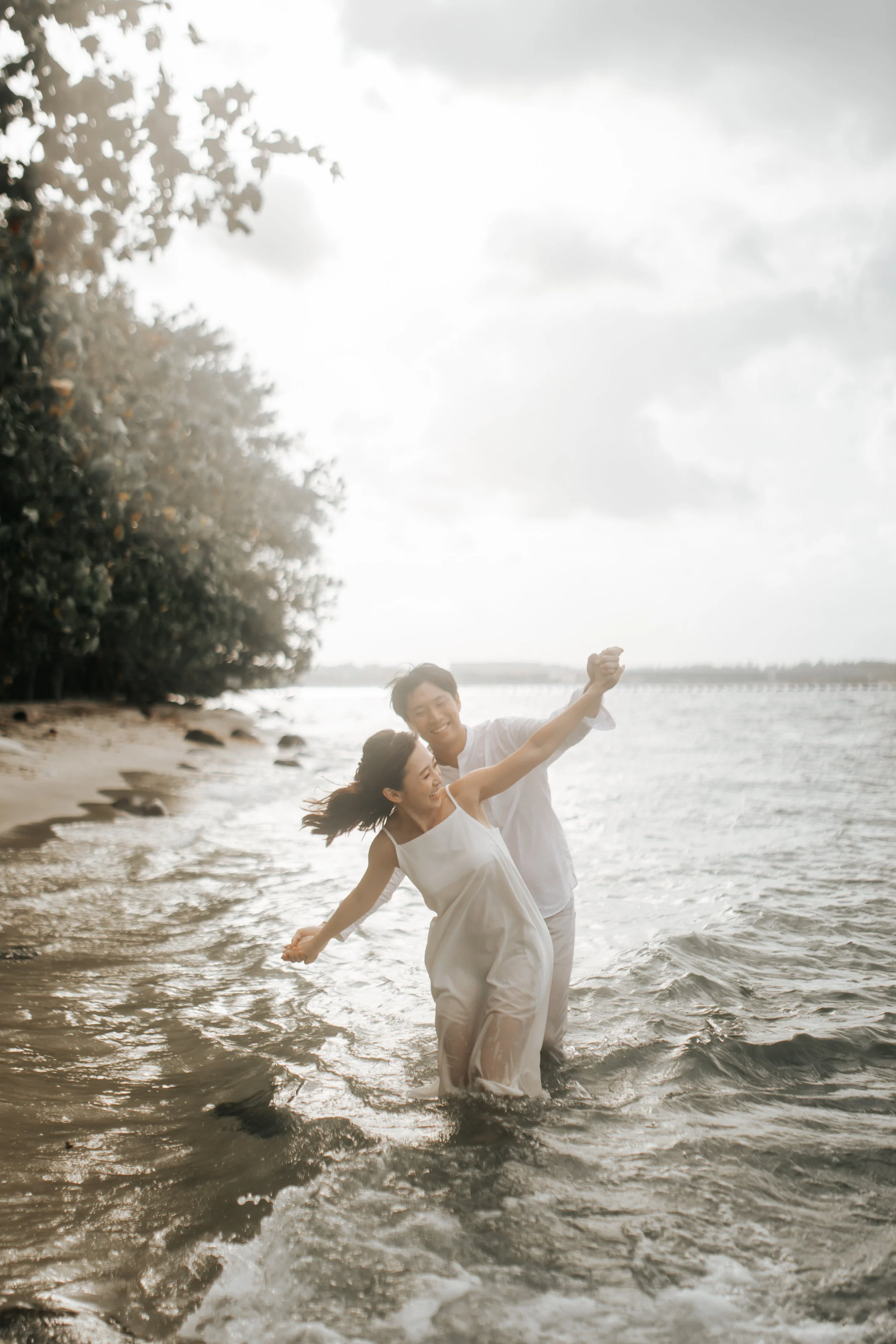 Relaxed and natural outdoor pre-wedding photoshoot at Coney Island beach in Singapore, captured by Arielle for Breadandbutterworks.