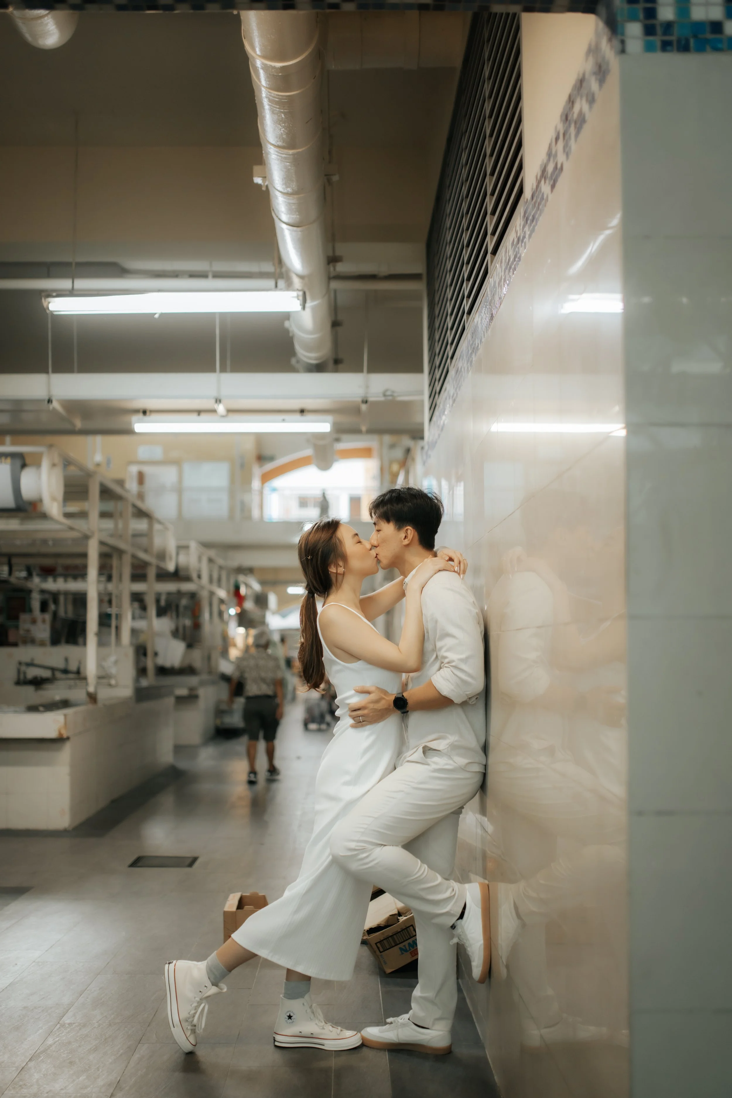 Light and airy pre-wedding photoshoot in the heartlands of Singapore, featuring a hawker centre. Captured by Ash for Breadandbutterworks.