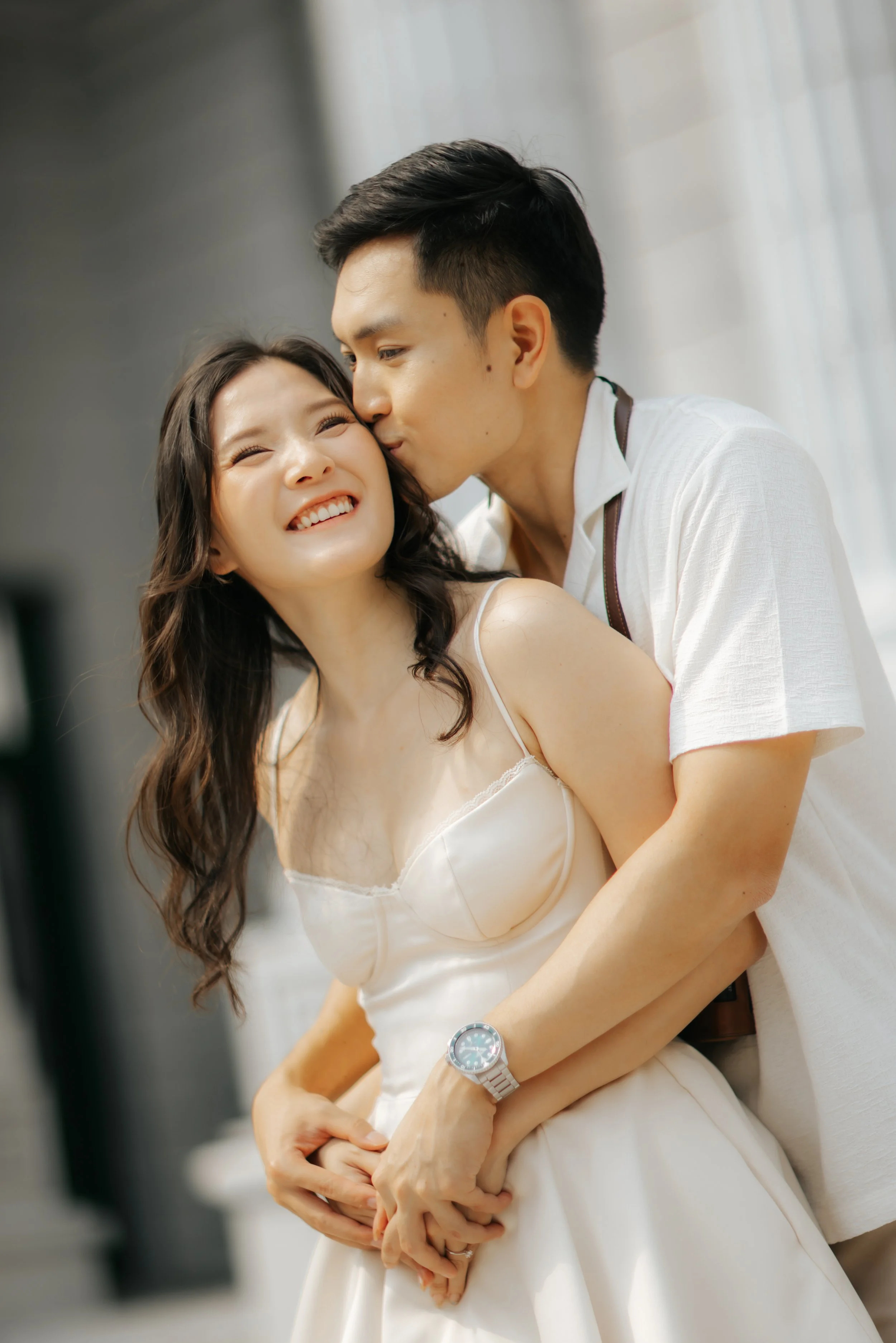 Couple posing for pre-wedding photoshoot in Universal Studios Singapore, captured by Ash for Breadandbutterworks.