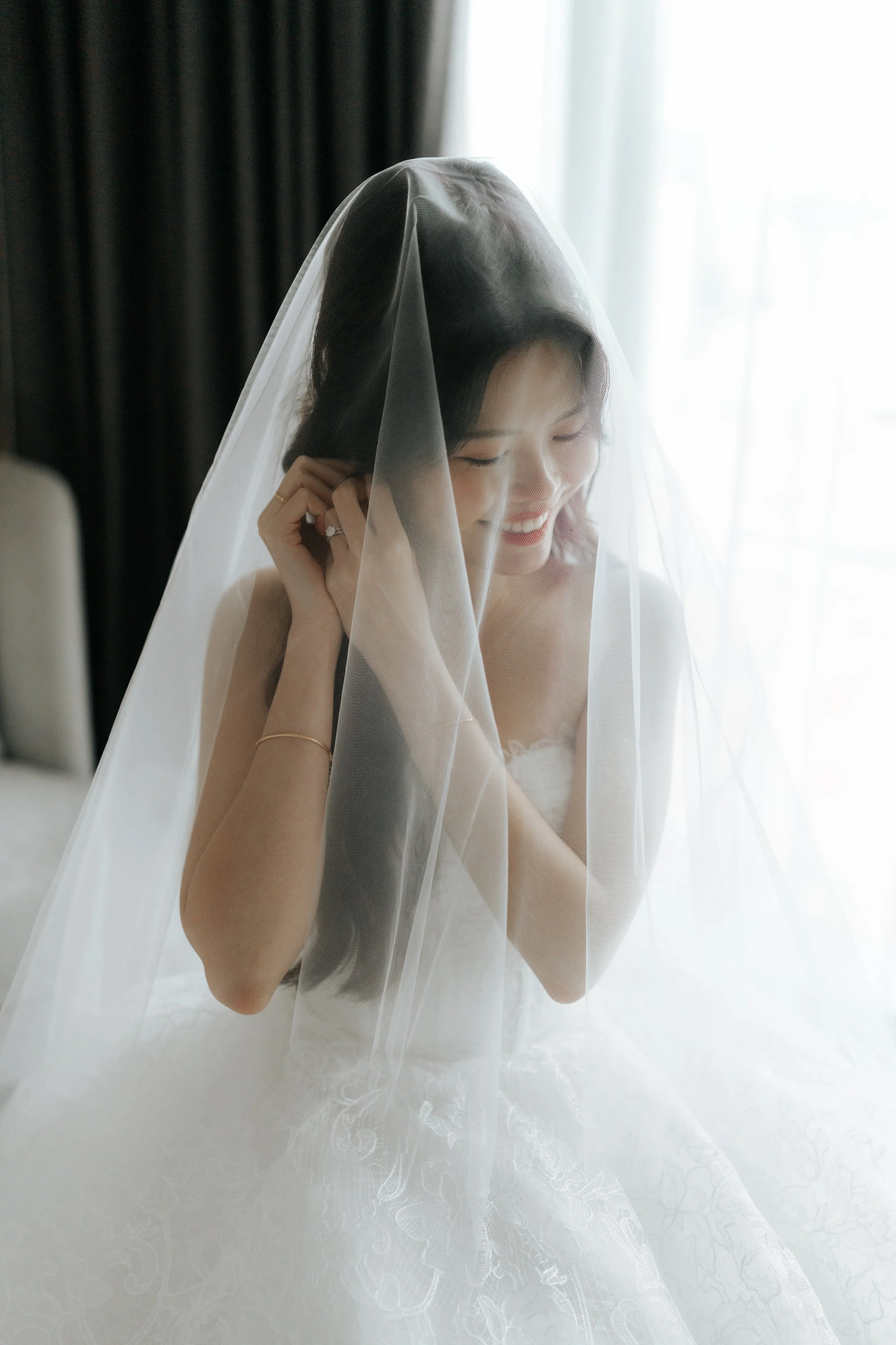 Ethereal actual day bridal photoshoot with her wedding veil, captured by Breadandbutterworks in a soft and heartfelt style.