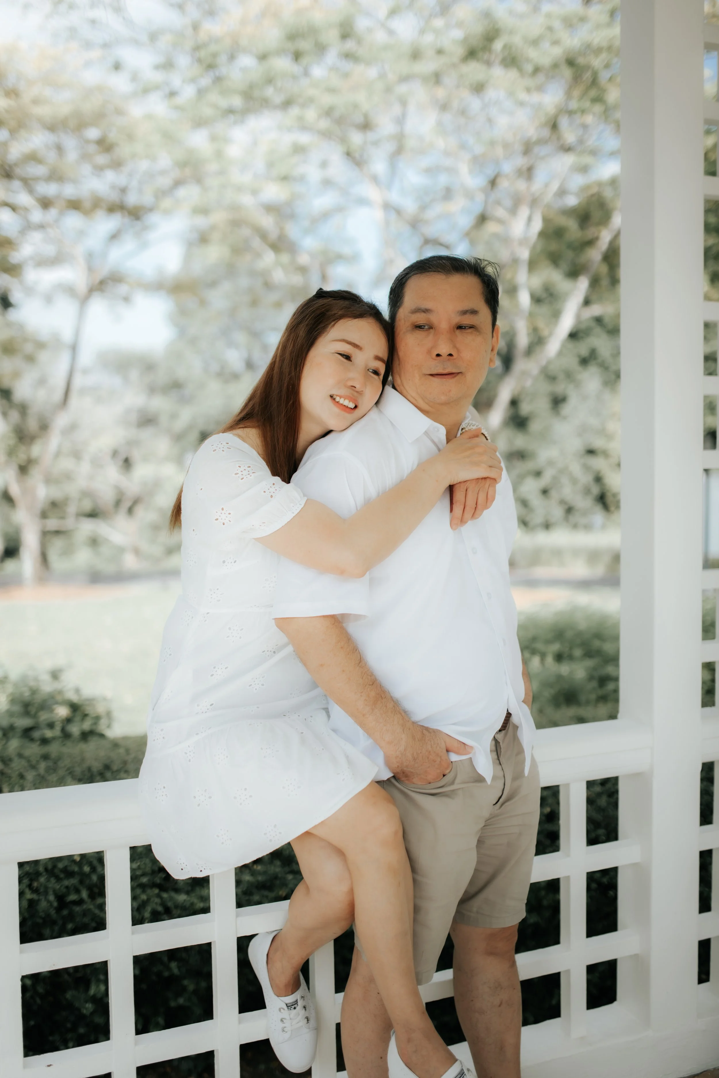 Light and airy family photoshoot in Singapore featuring the couple's parents, captured by Breadandbutterworks.
