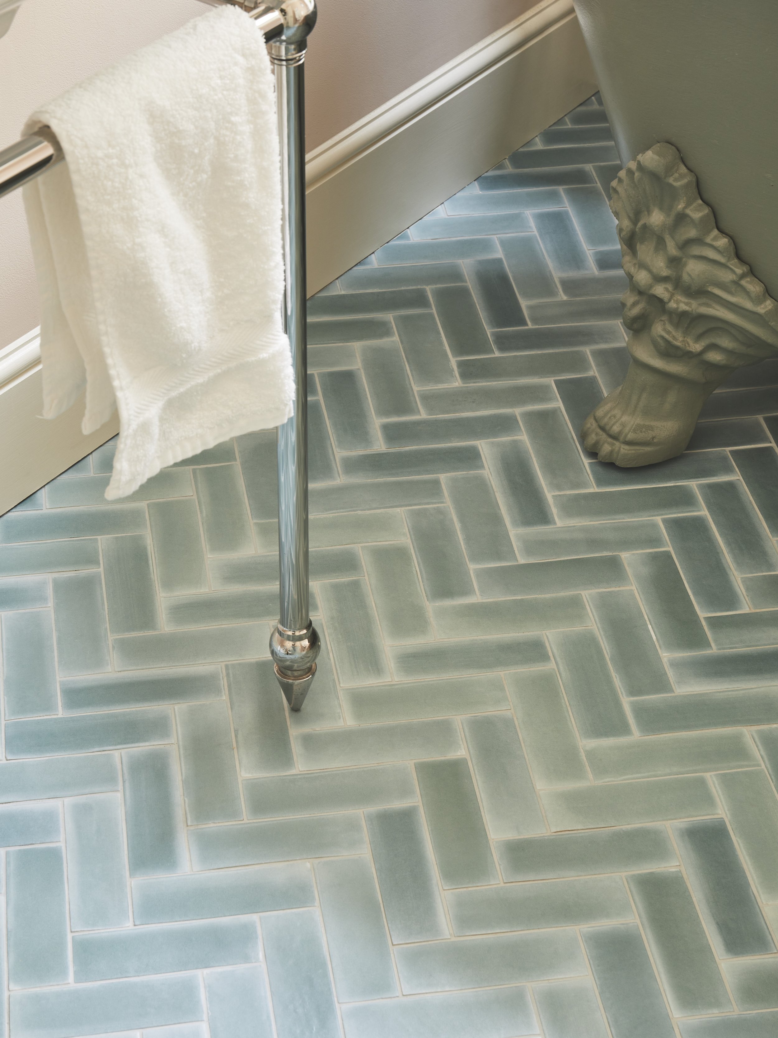 A 'herringbone' set out for tiles with subtle variation and toning grout. 