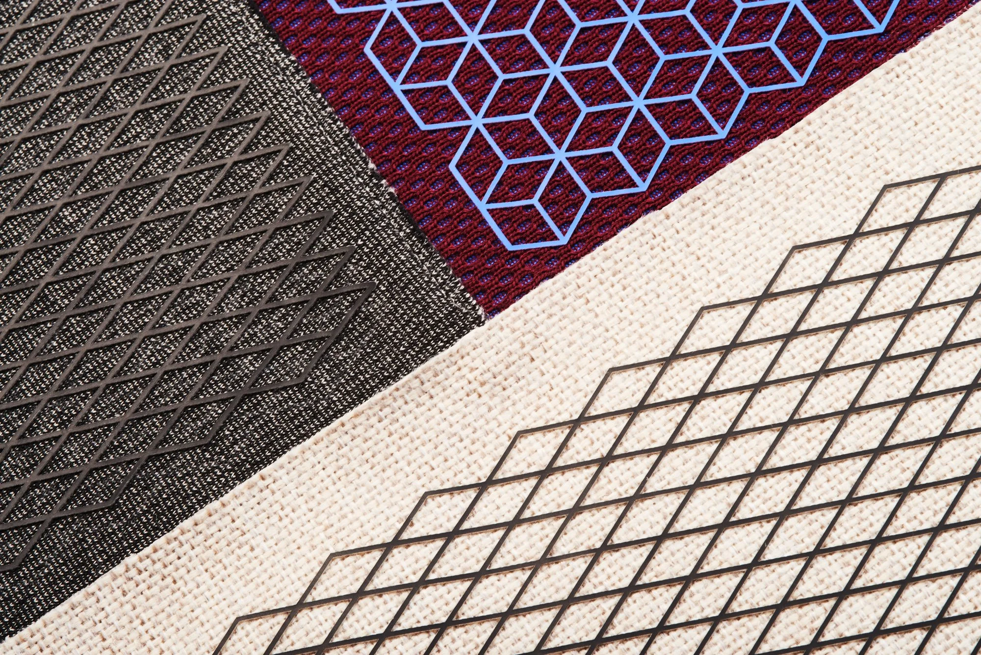 Abstract geometric patterns with blue and black outlines on textured surfaces.