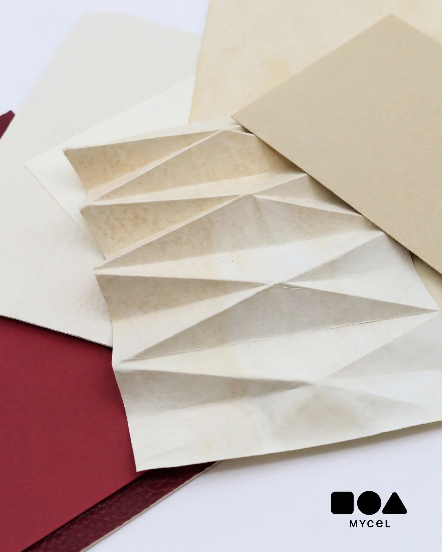 @mycelinc's mycelium based fabric combines the foldability and flexibility of a paper with the durability of a non-woven. Here, the material is folded into an origami pattern to create a structure, pattern and depth. 
#MaterialsFirst #CMFdesign #Mate
