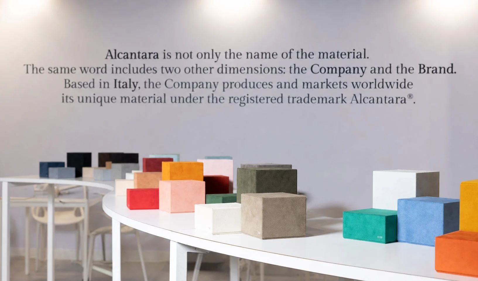boxes of Alcantara arranged on central display table to showcase the colour possibilities