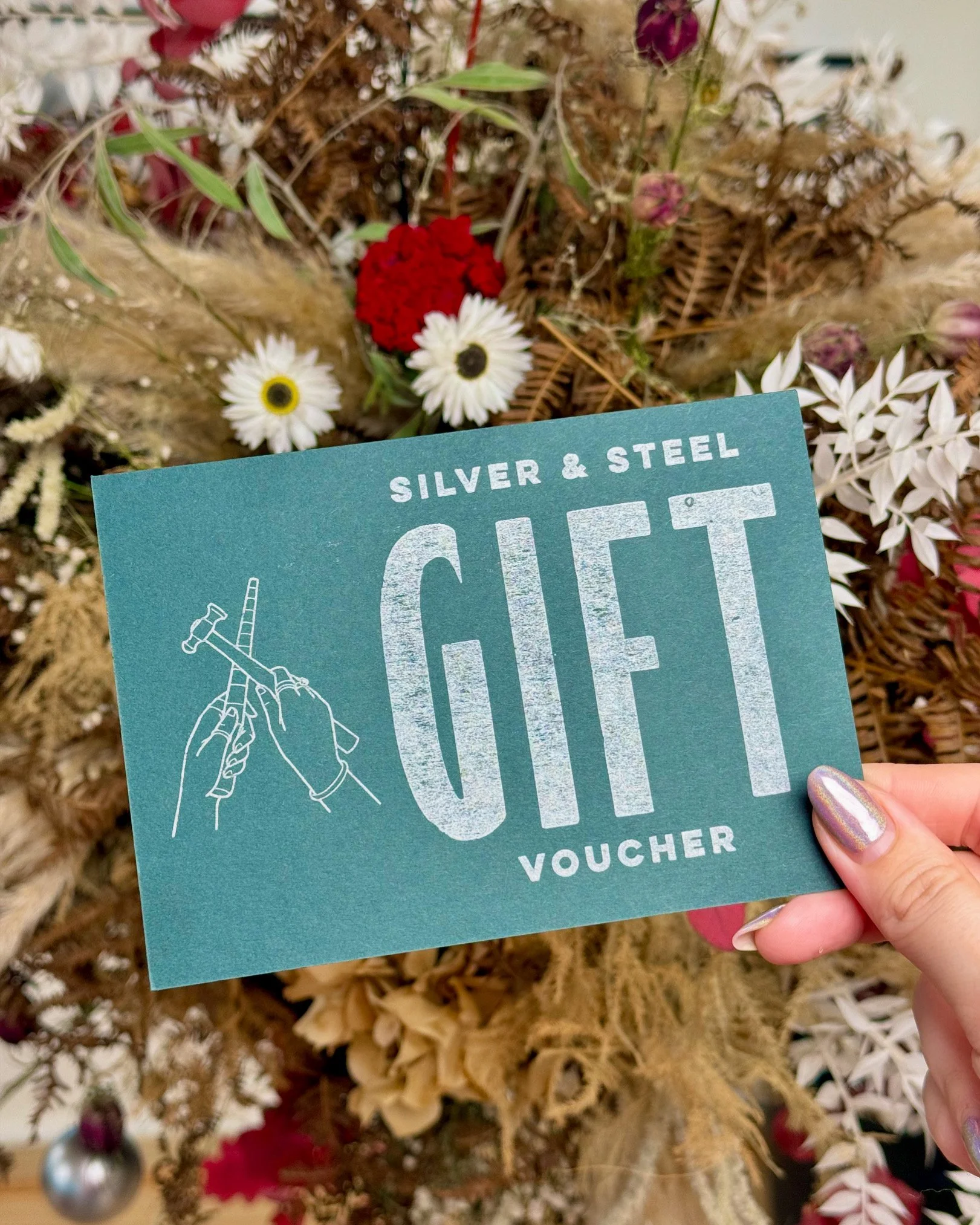 A gift card for jewellery workshops with a Christmas background