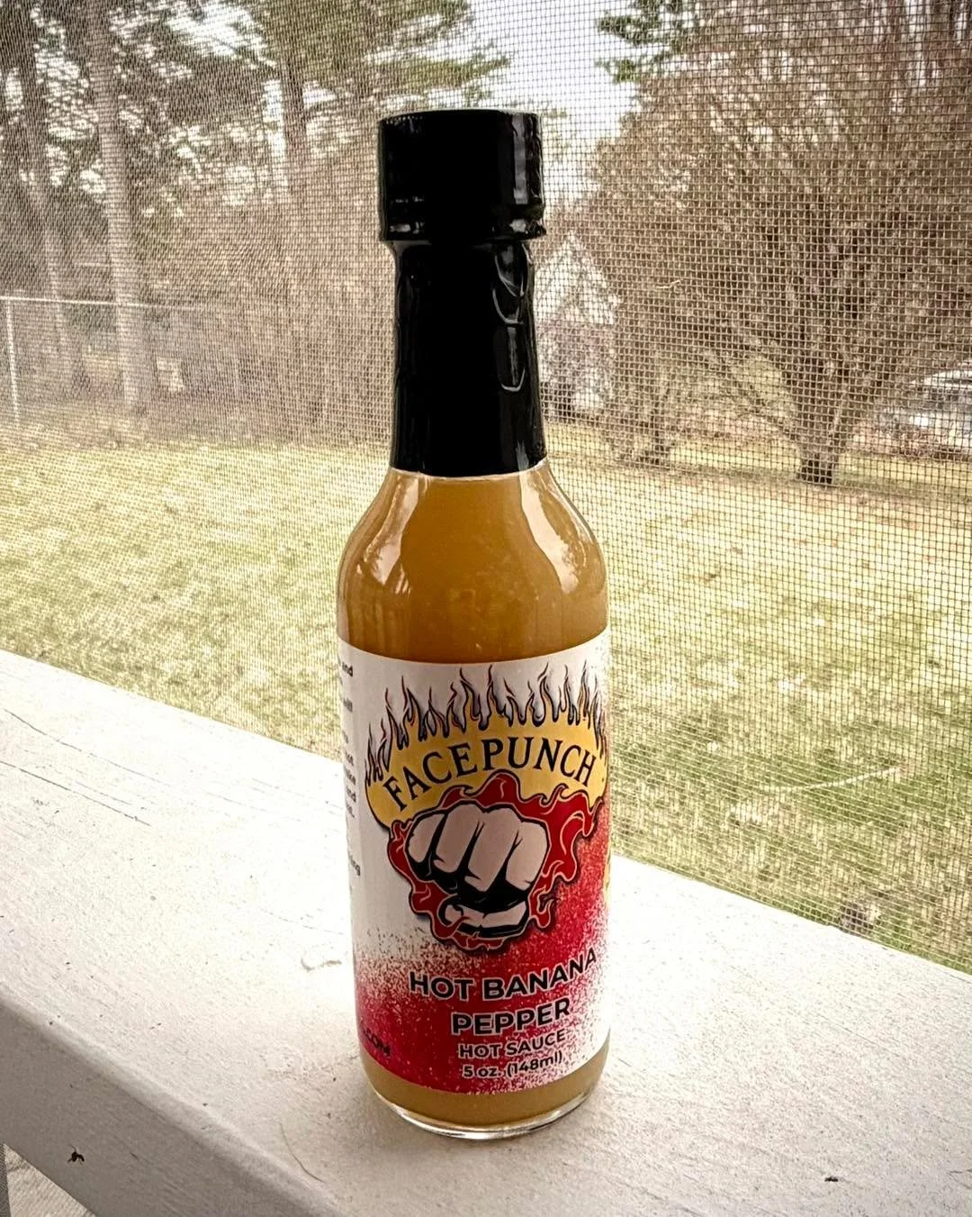 Spring is trying&hellip; and we&rsquo;re helping it along one face punch at a time. 🌱🔥

The grass might still be waking up, but this bottle?
She&rsquo;s already wide awake.

Hot Banana Pepper on the porch = crisp air, sunshine creeping in, and flav