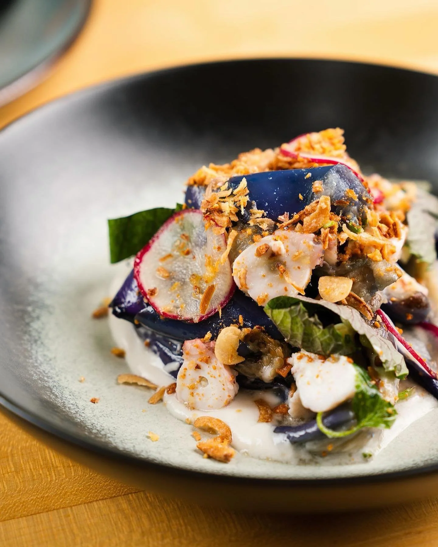 Octopus Salad! Chef Thai&rsquo;s favorite on the menu. A soft coconut sauce at the base, perfectly cooked eggplant, tender octopus with lots of textures and flavors. Mix together and share with your bestie. #tasteofvietnam #haisous