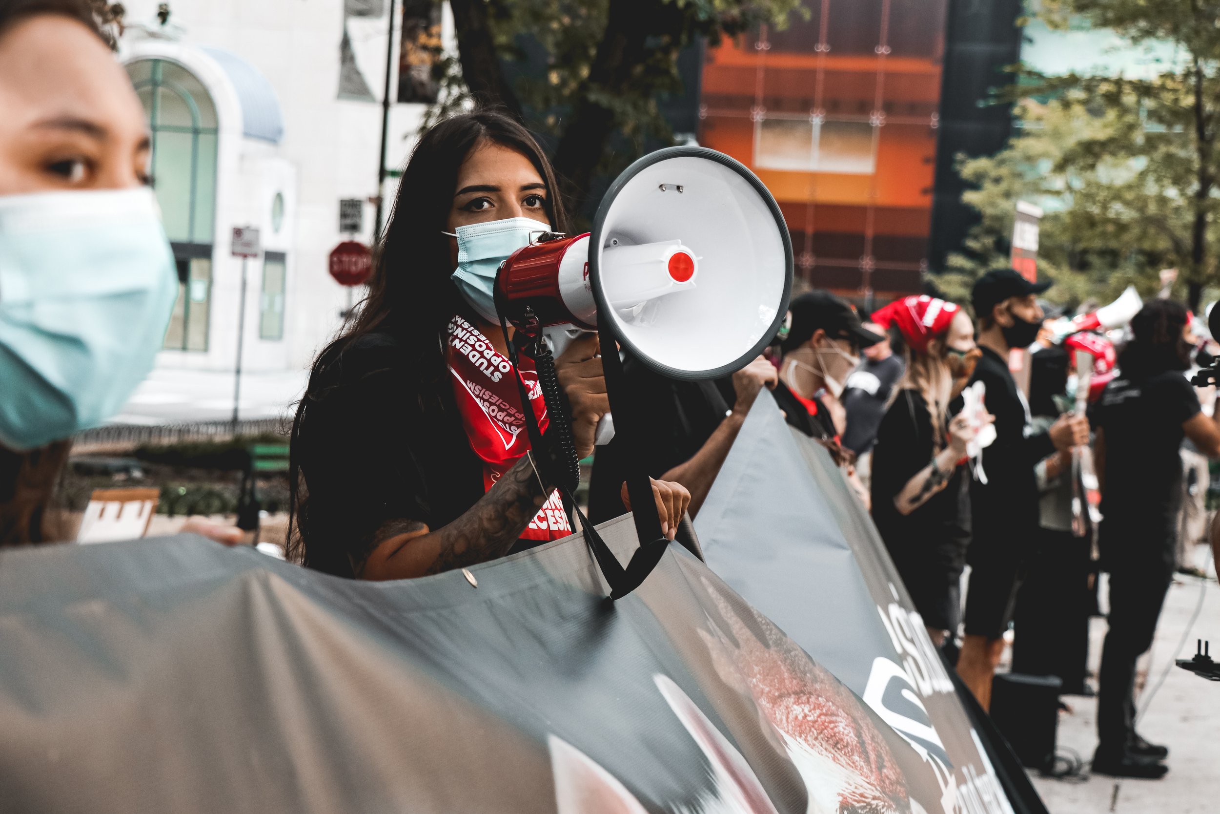 Nisha Kumar, 30, chants the group’s slogans through a megaphone, as all protesters raise their voice in community. Through call and response, they chant “raise your voice and raise your fist, stop being a speciesist”
