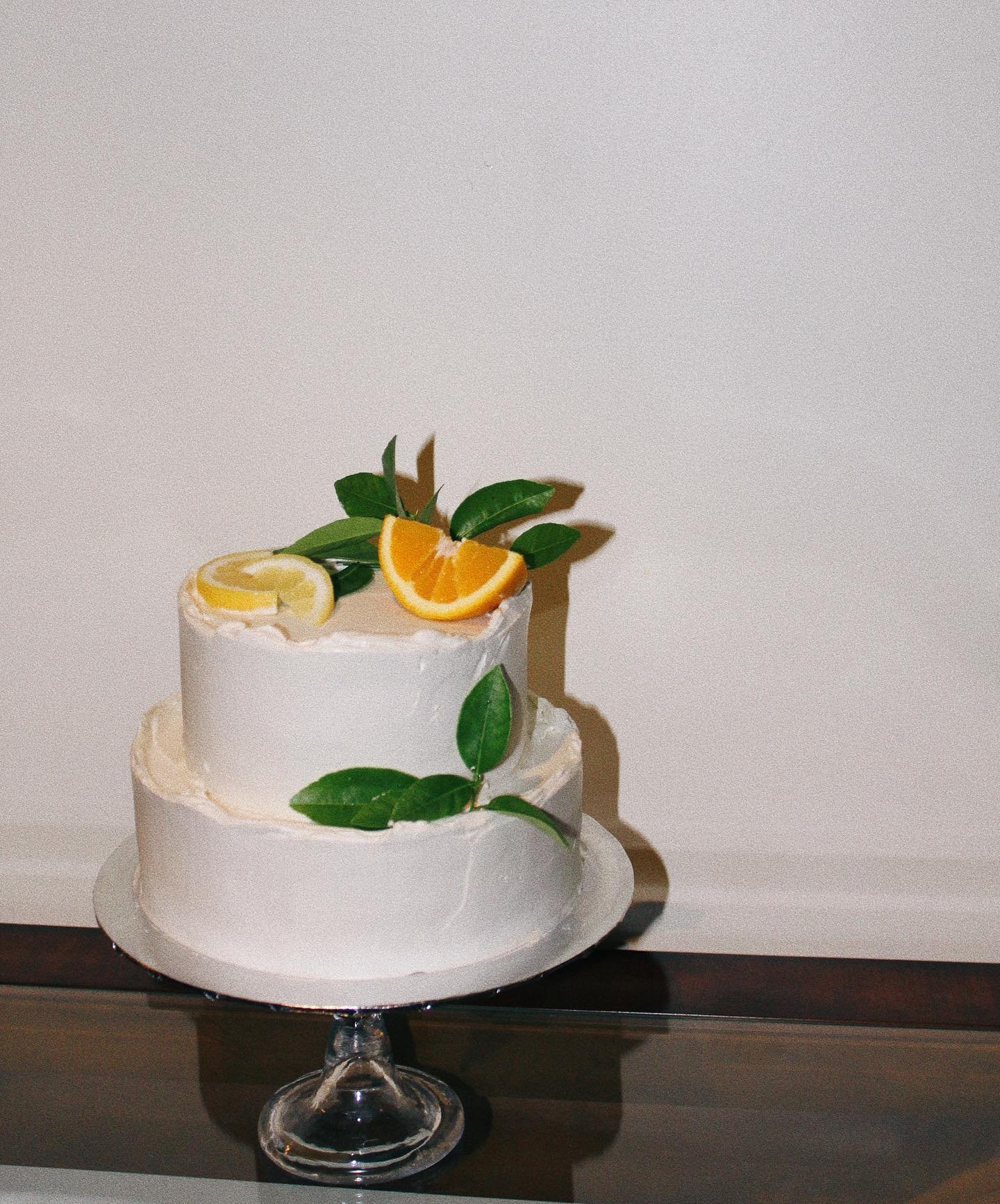 vanilla chiffon cake with citrus soak layered with a sesame crunch + charred citrus compote 🍊 
covered with a smooth and silky swiss buttercream 

Had so much fun creating this cake and all its components! - deep toasted flavors from the sesame bala