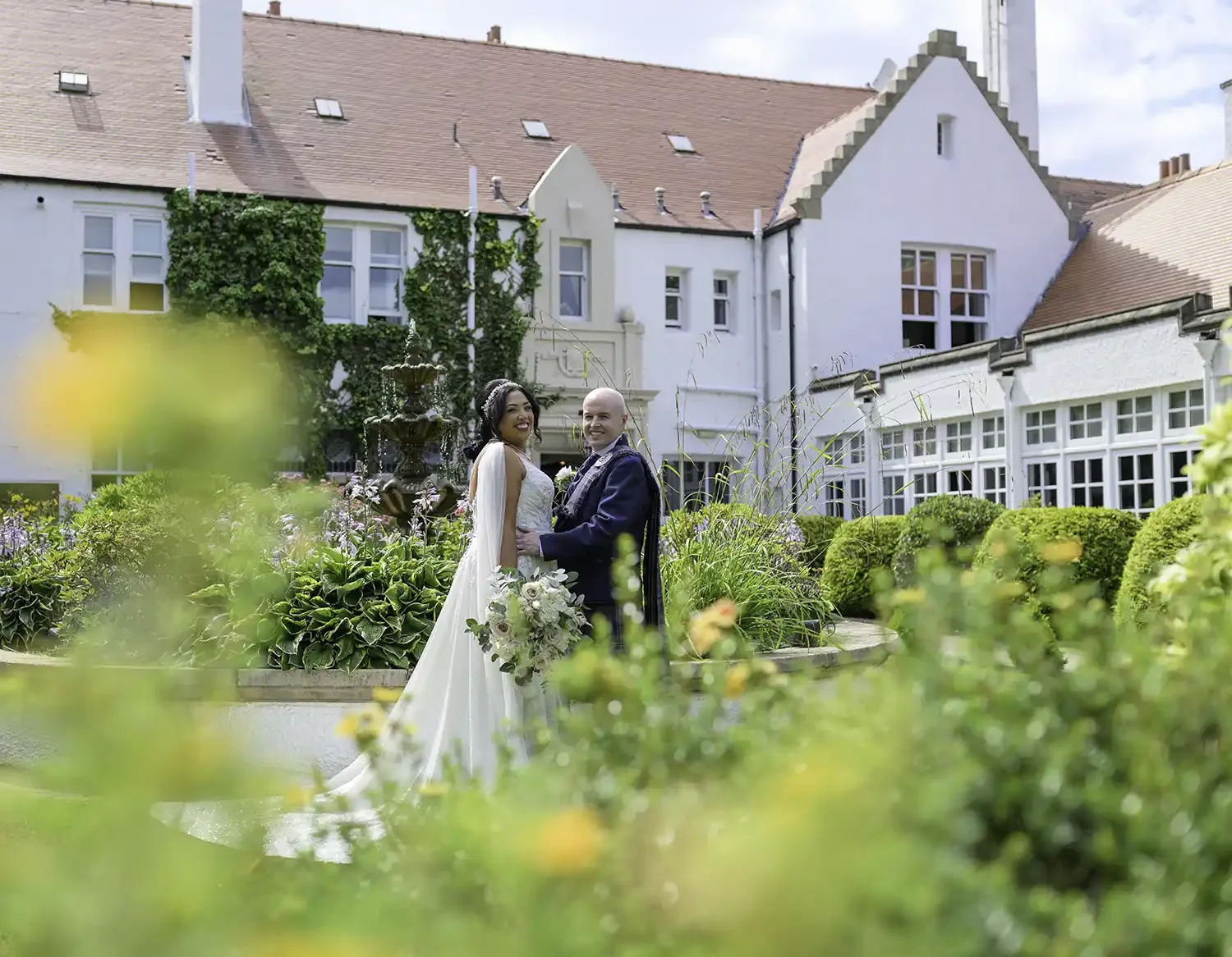Bride and groom portrait in the gardens at Lochgreen House Hotel wedding venue in Troon Ayrshire