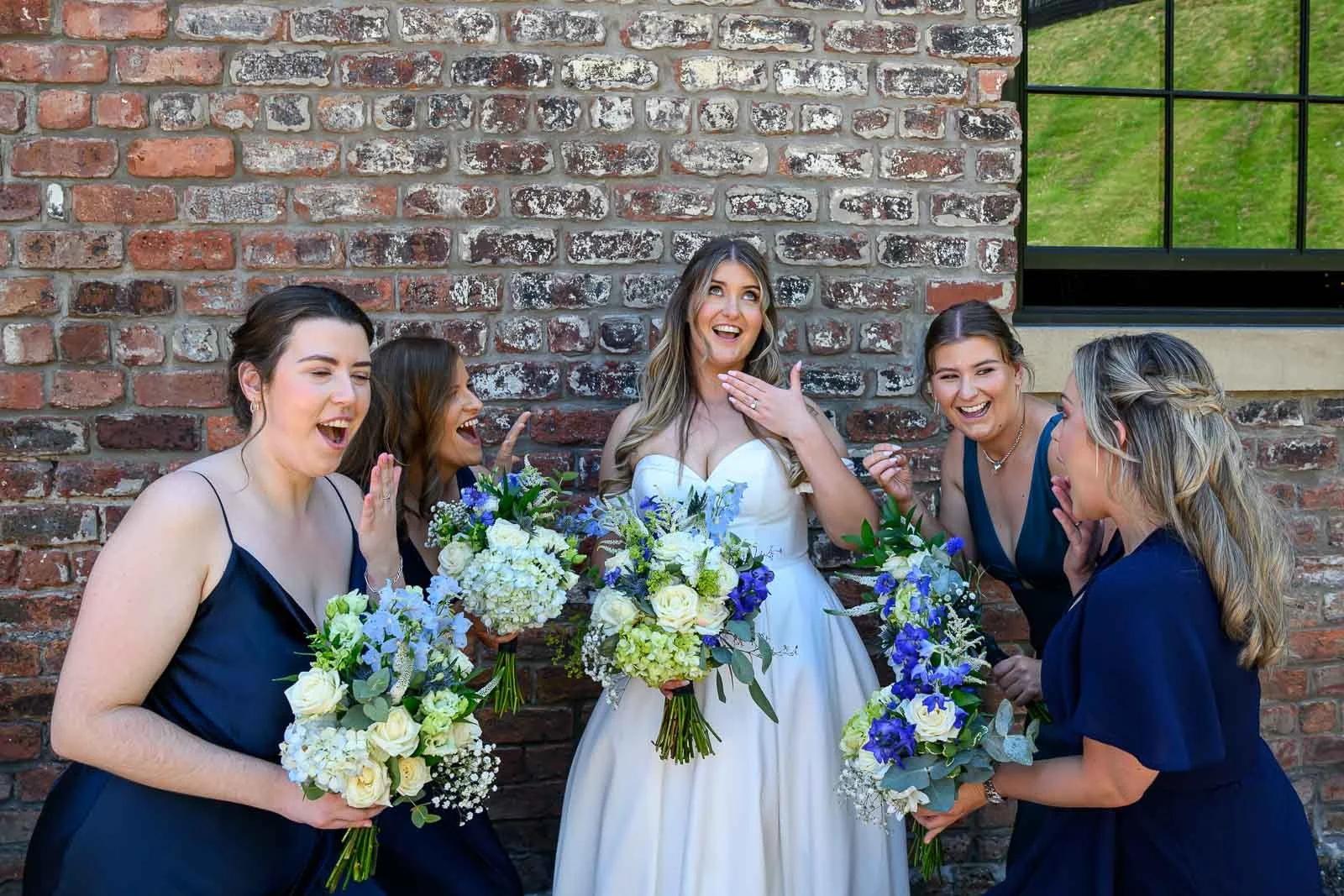 Candid bridesmaids laughing during a relaxed wedding celebration in Glasgow – natural wedding photography by Thomas McCabe
