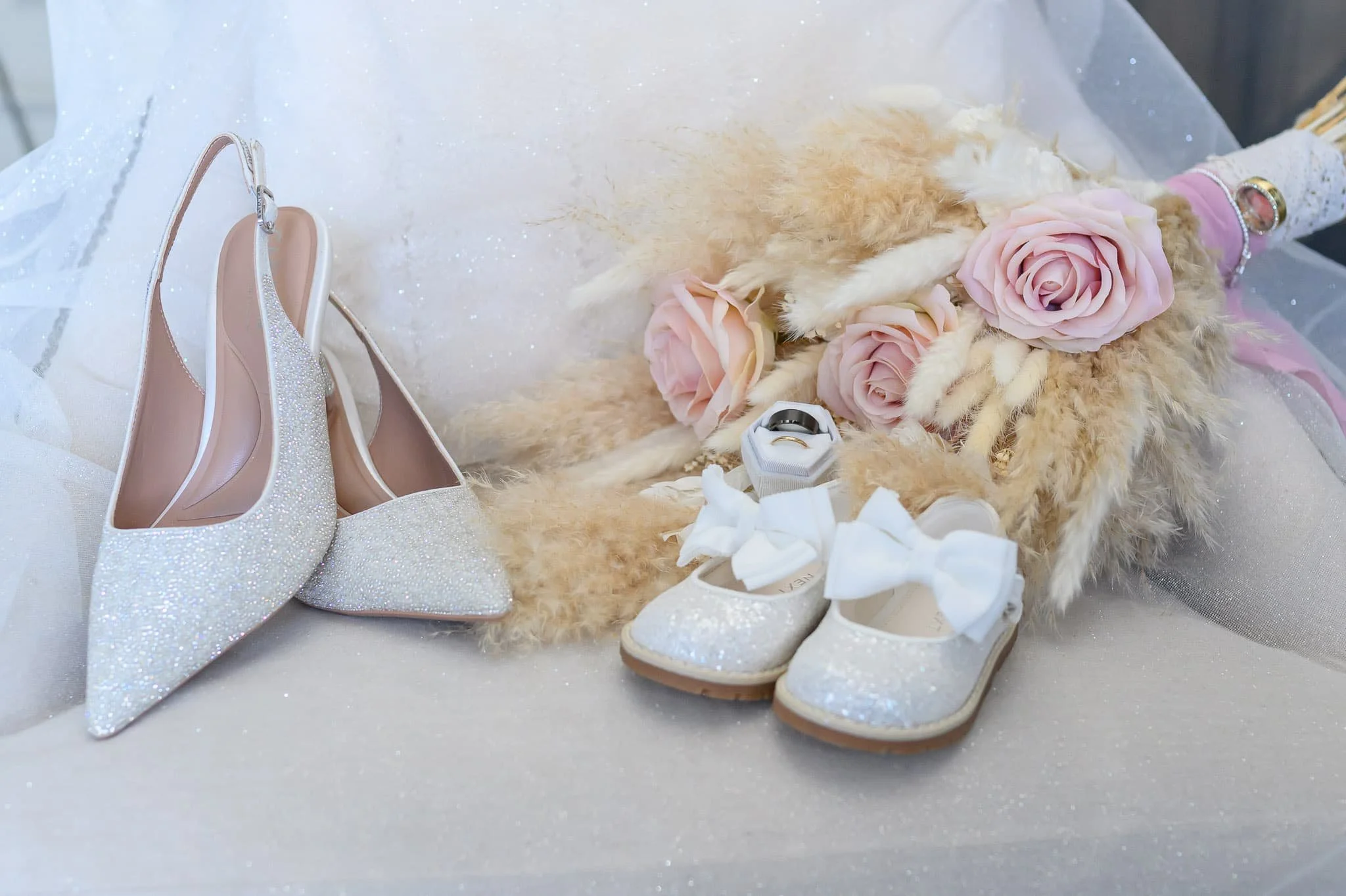 Bridal shoes, bouquet and wedding rings photographed at Brisbane House Hotel in Largs.