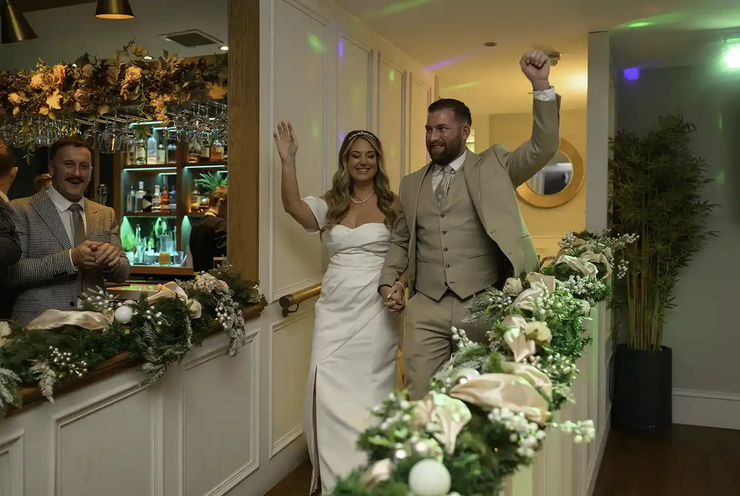 Bride and groom making their grand entrance at The Stravaig wedding reception in Ayr